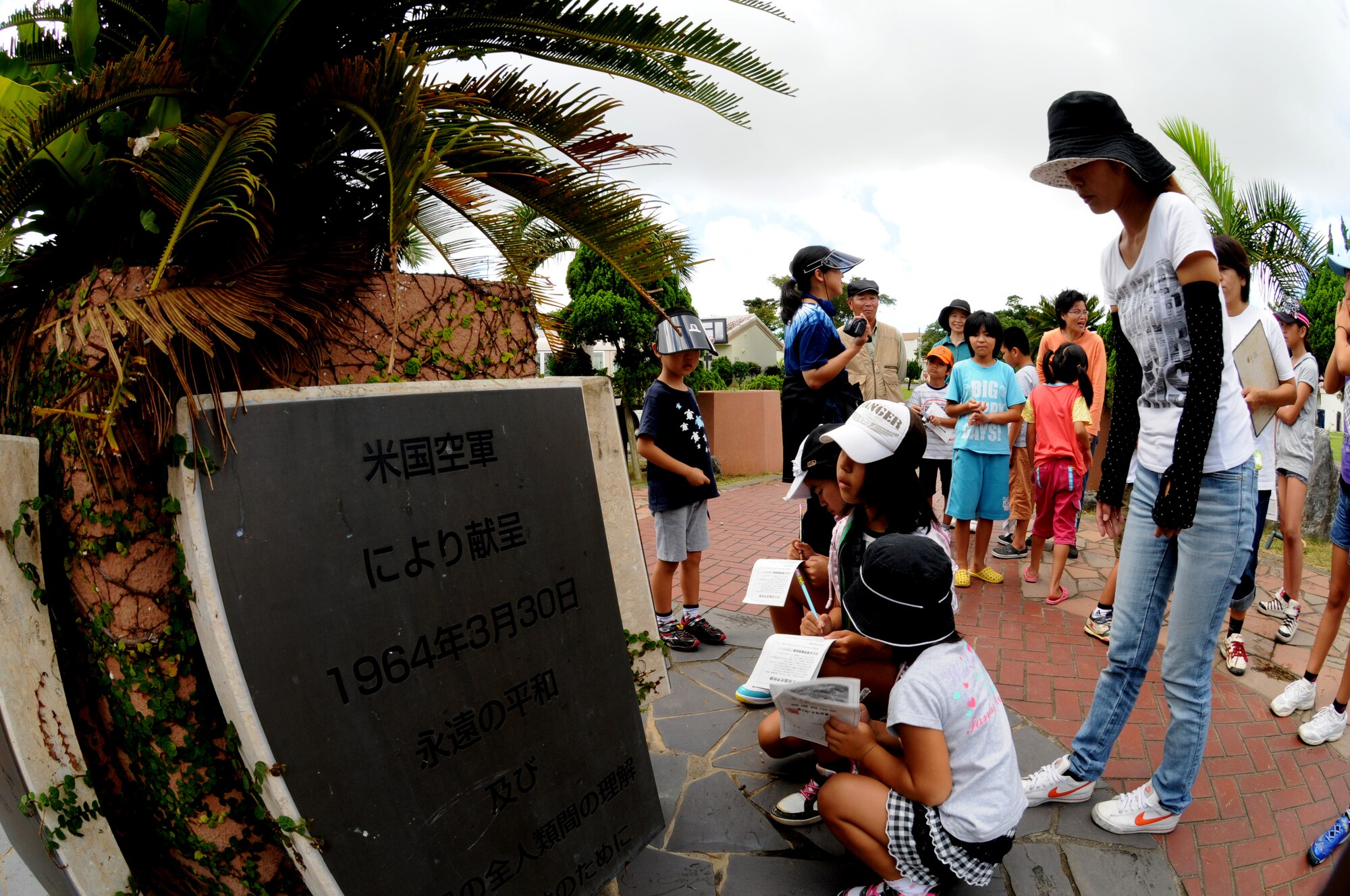 Participants from the Misato area children's group look at dedication plaques during the group's visit to World War II historical sites July 29, Kadena Air Base, Japan. The group partake in an annual peace education event organized by Misato Residents' Association during the summer vacation. (U.S. Air Force photo/Airman 1st Class Jarvie Z. Wallace)
