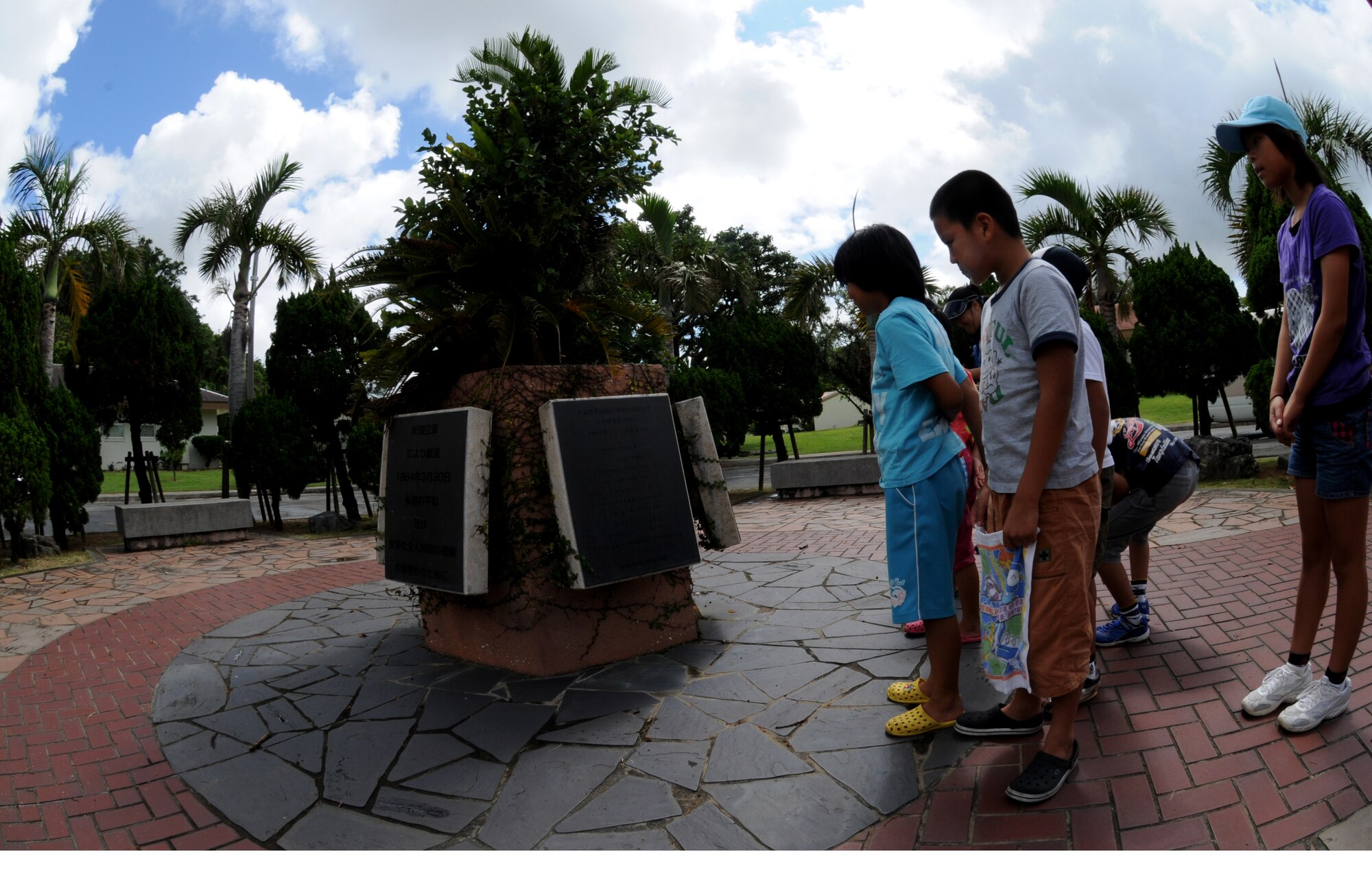 Participants of the Misato area Kodomo-Kai children's group look at dedication plaques during the group's visit to World War II historical sites July 29, Kadena Air Base, Japan. The group partake in an annual peace education event organized by Misato Residents' Association during the summer vacation. (U.S. Air Force photo/Airman 1st Class Jarvie Z. Wallace)
