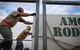 Tech. Sgt. Michael Heifner and Staff Sgt. Graig Penna off-load cargo on the flight line at Joint Base Lewis-McChord, Wash., during Air Mobility Rodeo 2011. Heifner and Penna are aerial porters assigned to the 730th Air Mobility Squadron at Yokota Air Base, Japan, and the 733rd Air Mobility Squadron at Kadena Air Base, Japan, respectively. Both units are part of the 515th Air Mobility Operations Wing, a geographically-separated unit comprised of six squadrons throughout the Pacific. It is headquartered at JBPHH. (U.S. Air Force photo/Staff Sgt. Carolyn Herrick)