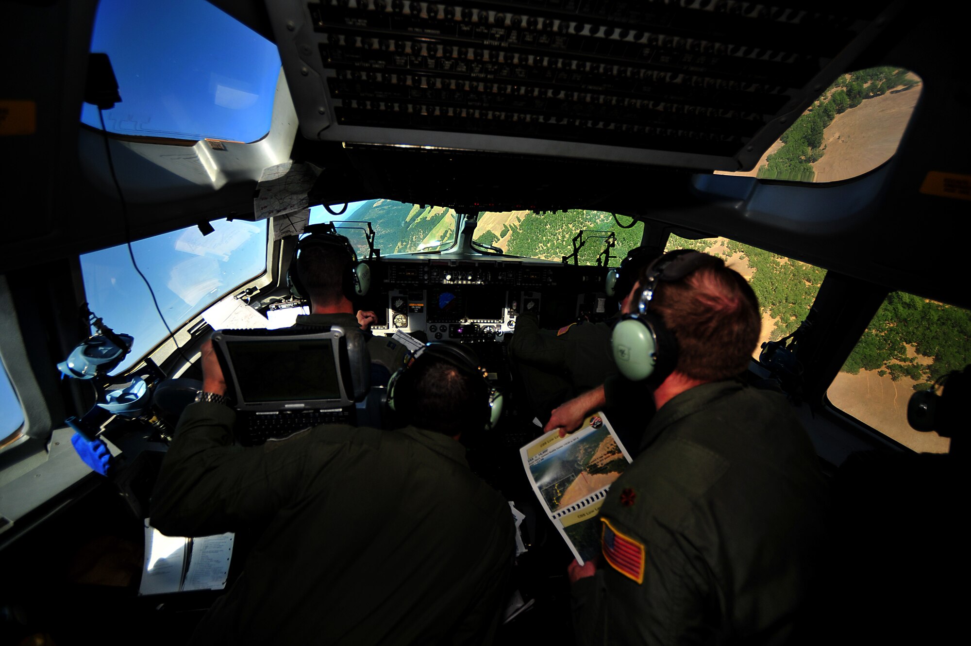 Crew members from Joint Base Pearl Harbor-Hickam, Hawaii, perform low-level maneuvers in a C-17 during a 2011 Air Mobility Rodeo contest at Joint Base Lewis-McChord, Wash., July 27. Air Mobility Rodeo is the U.S. Air Force's and Air Mobility Command's premier international combat skill and flying operations competition designed to develop and improve techniques, procedures and interoperability, while optimizing international mobility partnerships and enhancing mobility operations. (U.S. Air Force photo/Staff Sgt. Nicholas Pilch) 