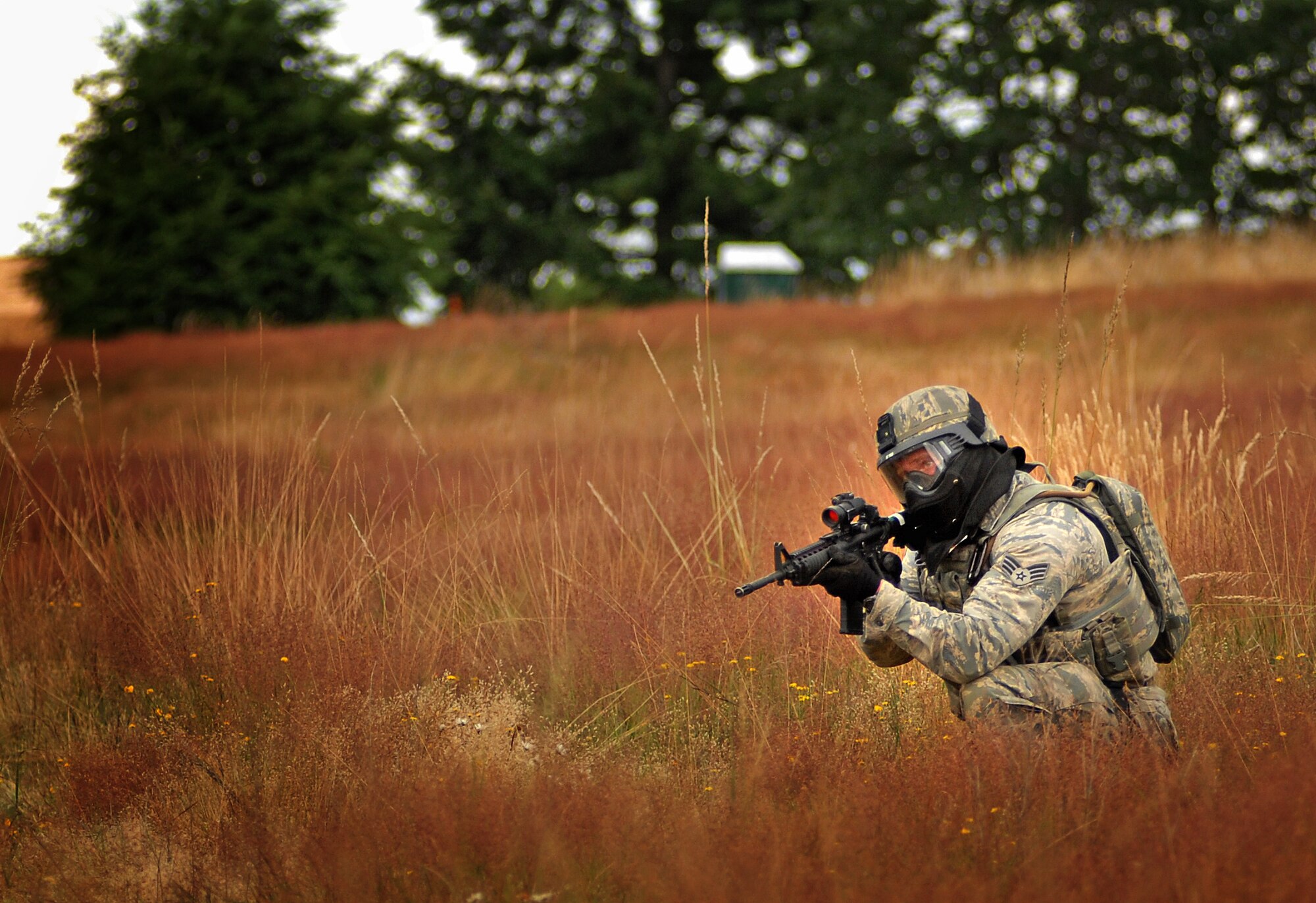 Senior Airman Chris Menefee, 647th Security Forces Squadron, provides security during a combat tactics event at the 2011 Air Mobility Rodeo at Joint Base Lewis-McChord, Wash., July 26. Menefee is stationed at Joint Base Pearl Harbor-Hickam, Hawaii. (U.S. Air Force photo by Staff Sgt. Carolyn Herrick)