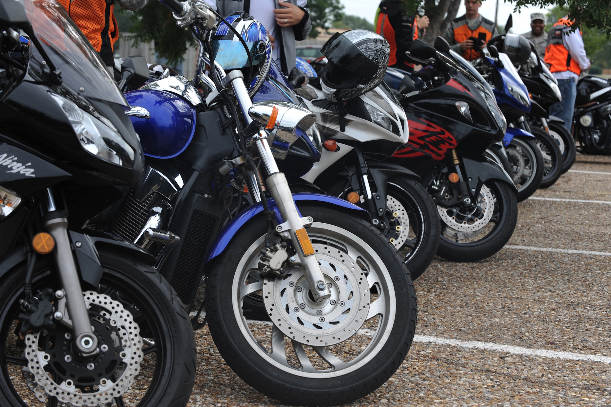 A line of motorcycles sit in the parking lot of Chapel 2 before departing for the Motorcycle Awareness and Remembrance Ride on Barksdale Air Force Base, La., July 29. All motorcycle enthusiasts that received the mandatory training on base were able to participate in the ride. (U.S.  Air Force photo/Airman 1st Class Micaiah Anthony)(RELEASED)