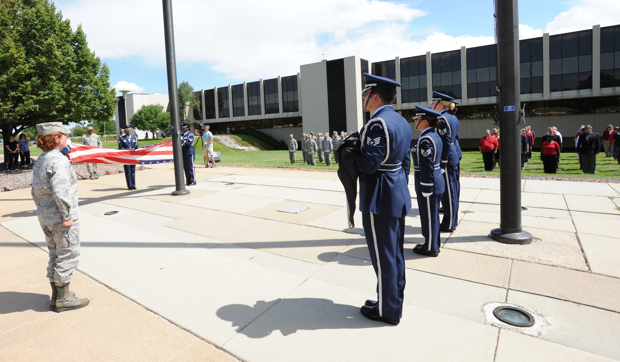 Col. Pat Blassie, Commander, ARPC, stands before a formation of military and
civilian personnel as the ARPC honor guard lowers the flag at ARPC for the last time on the former Lowry AFB.  On Aug. 1, ARPC moved to Buckley Air Force Base, Colo.  (U.S. Air Force photo/ Quinn Jacobson, ARPC/PA)

