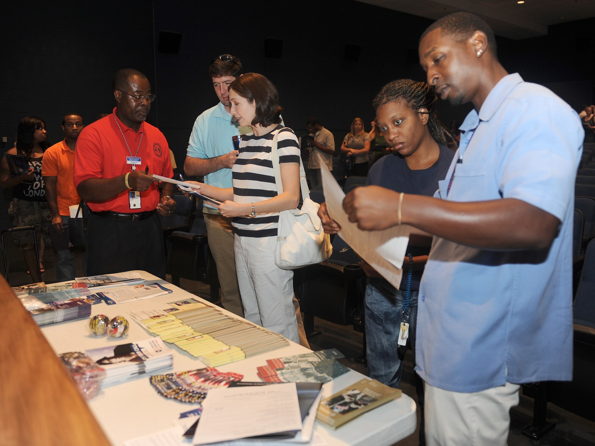 Veteran Administration representatives provide benefit information to inactive reserve members during the Individual Ready Reserve (IRR) Muster at Langley Air Force Base, Va., July 29, 2011. Enlisted Airmen of the IRR are bound to service based on their initial enlistment obligation of eight years, regardless of their active duty service tenure, while officers must report until they voluntarily resign their commission.(U.S. Air Force photo by Staff Sgt. Antoinette Gibson/Released)


