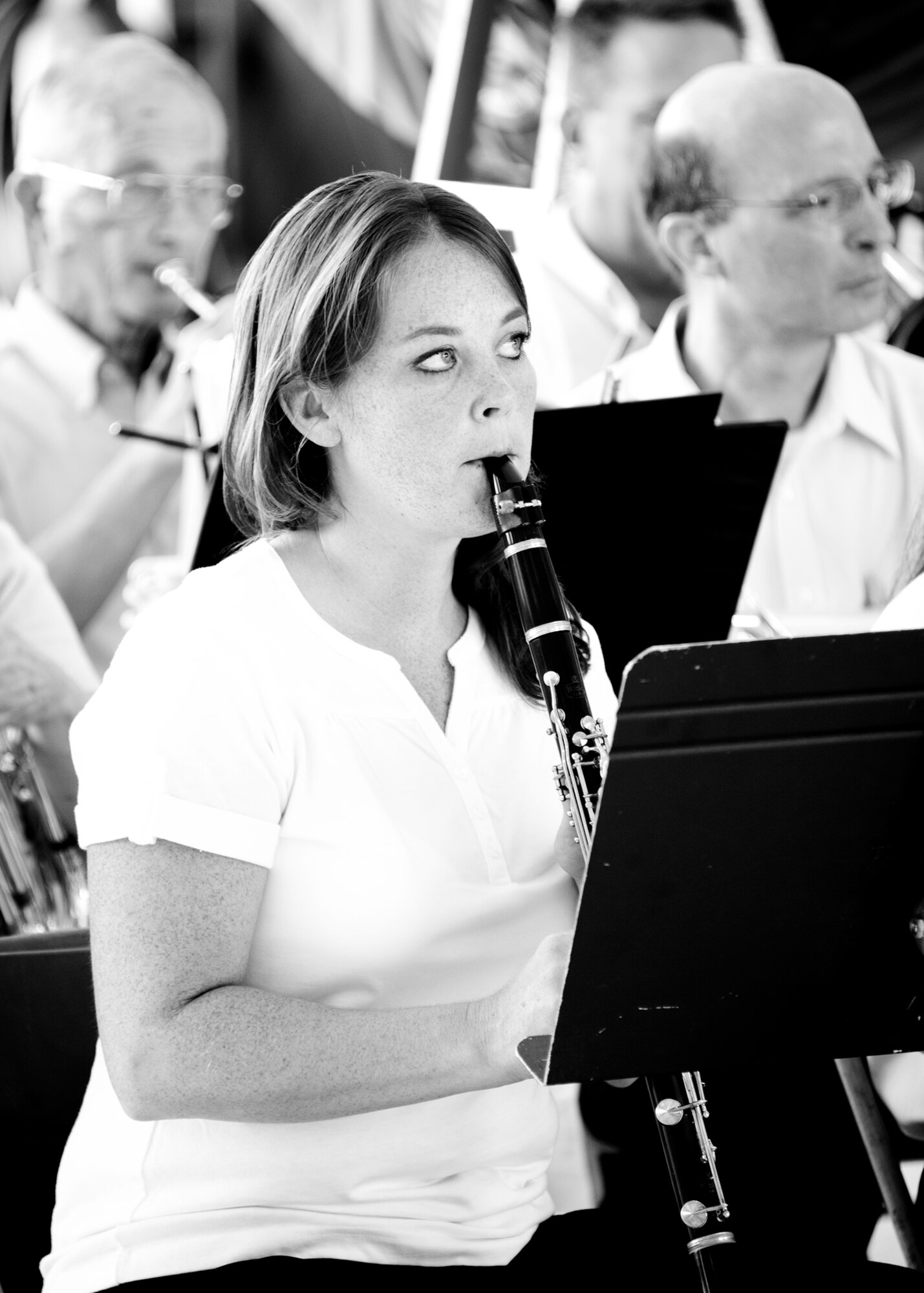 A clarinetist watches her conductor during a change of command ceremony at Eglin Air Force Base, Fla.  (U.S. Air Force photo/Samuel King Jr.)
