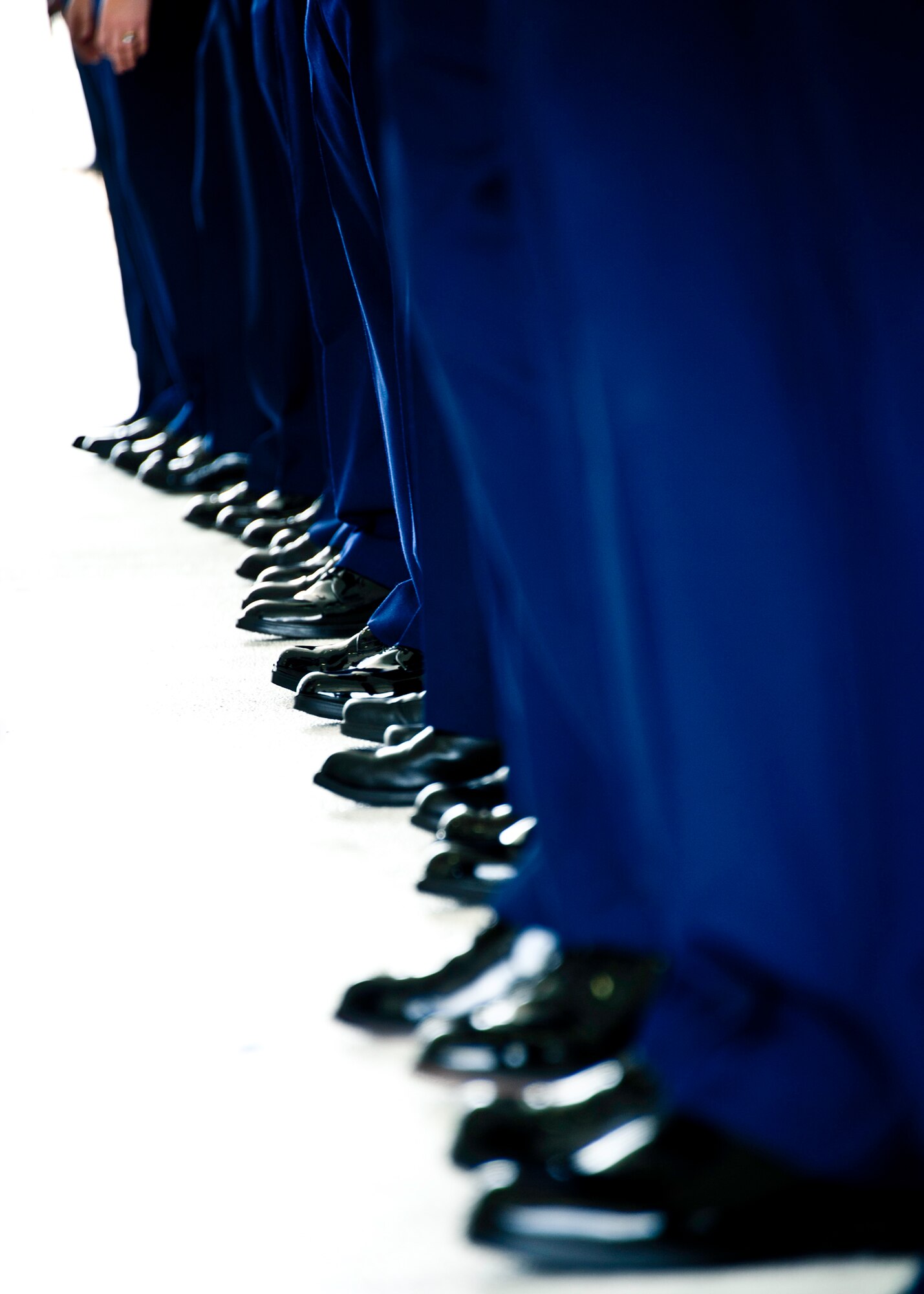 A line of Airmen wait for a change of command ceremony at Eglin Air Force Base, Fla.  (U.S. Air Force photo/Samuel King Jr.)
