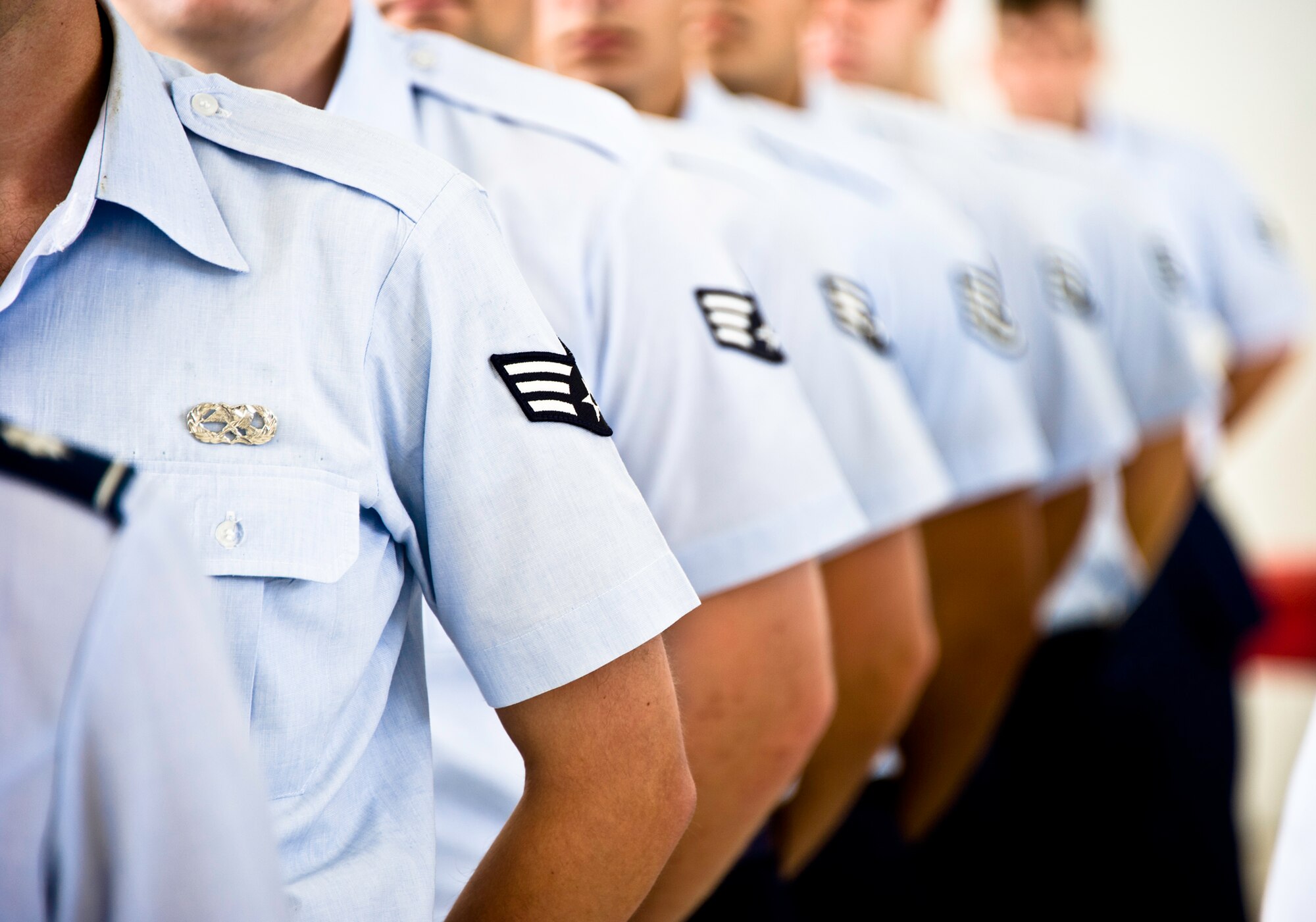 Enlisted Airmen from the 53rd Electronic Warfare Group, stand at parade rest during the 53rd Wing change of command July 26 at Eglin Air Force Base, Fla.  (U.S. Air Force photo/Samuel King Jr.)