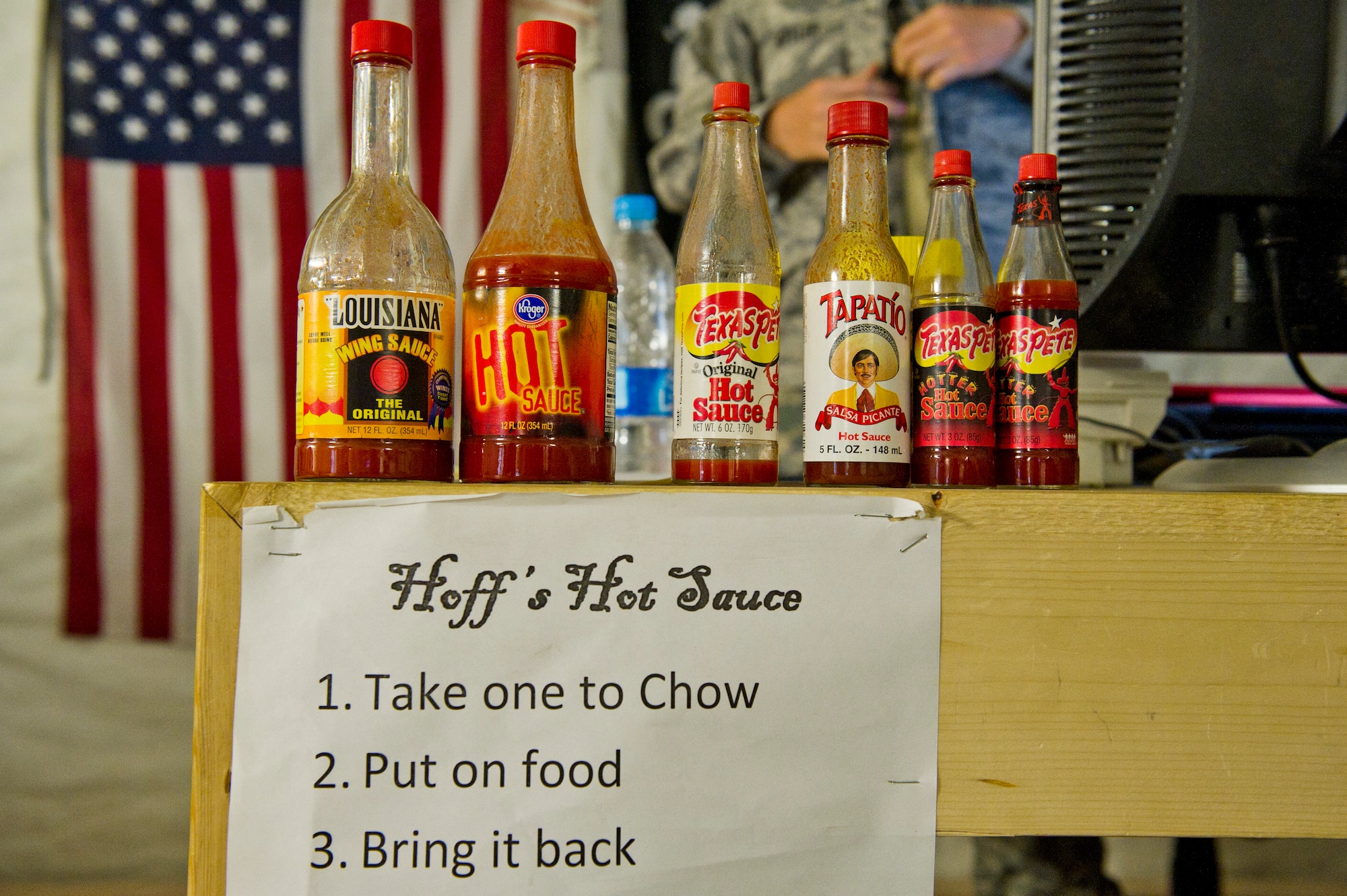 Several brands of hot sauce make up 1st Lt. Bryan Hoffler's "Hoff's Hot Sauce" collection. Airmen assigned to Camp Etchberger in western Afghanistan do not have dining facilities in their camp. They travel to a nearby Spanish dining facility for two hot meals per day. The Spanish dining facility does not have hot sauce available so Airmen bring some from the camp. (U.S. Air Force Photo/Master Sgt. Jeffrey Allen)