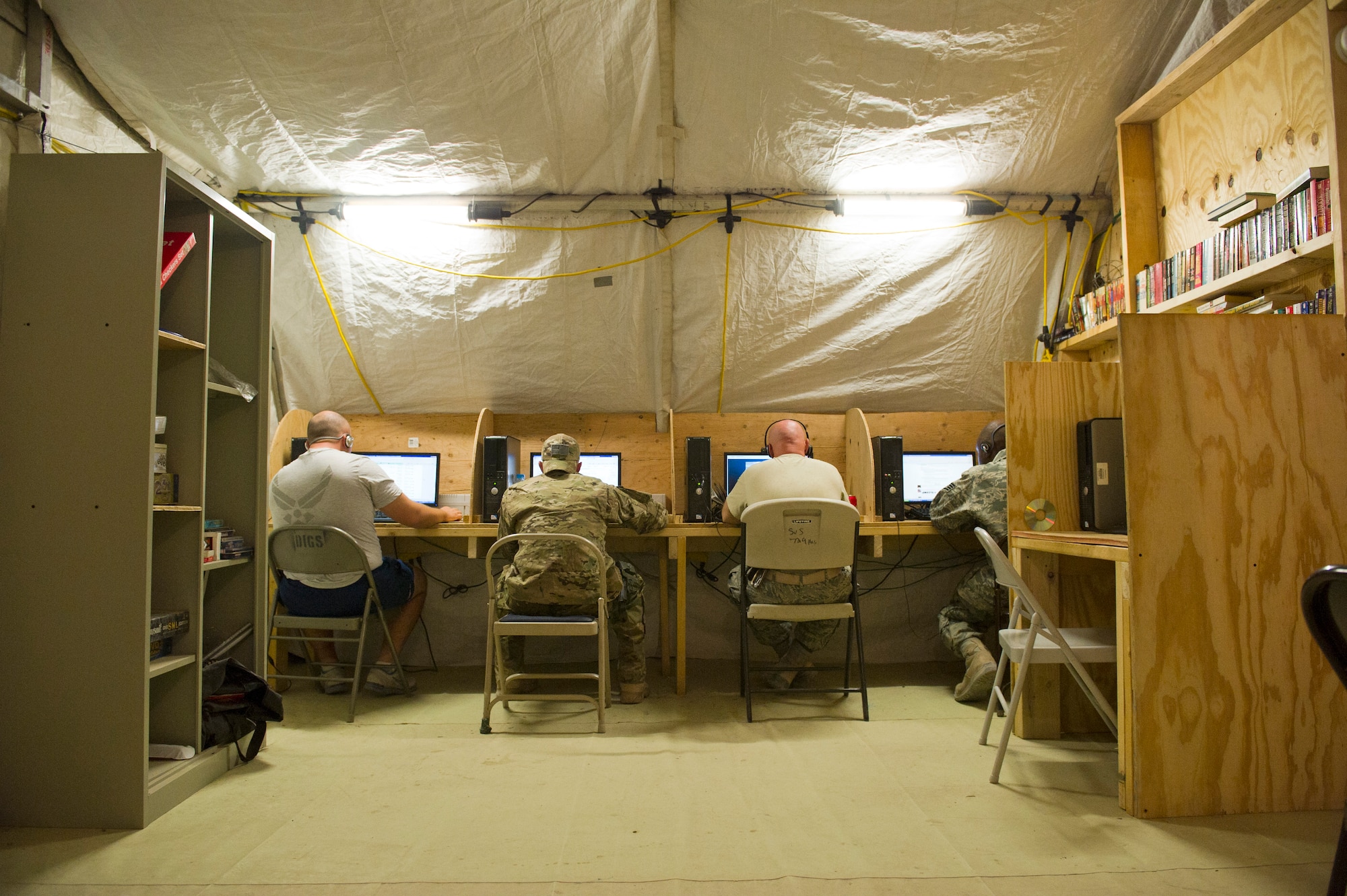 Members of Detachment 1, 73rd Expeditionary Air Control Squadron use the computers in the camp's small morale, welfare and recreation tent. The  MWR tent is a place where Airmen can use internet, watch TV or play video games. Camp Etchberger is isolated from any major U.S. military installation and lacks many of the recreation activities associated with bigger bases. (U.S. Air Force Photo/Master Sgt. Jeffrey Allen)