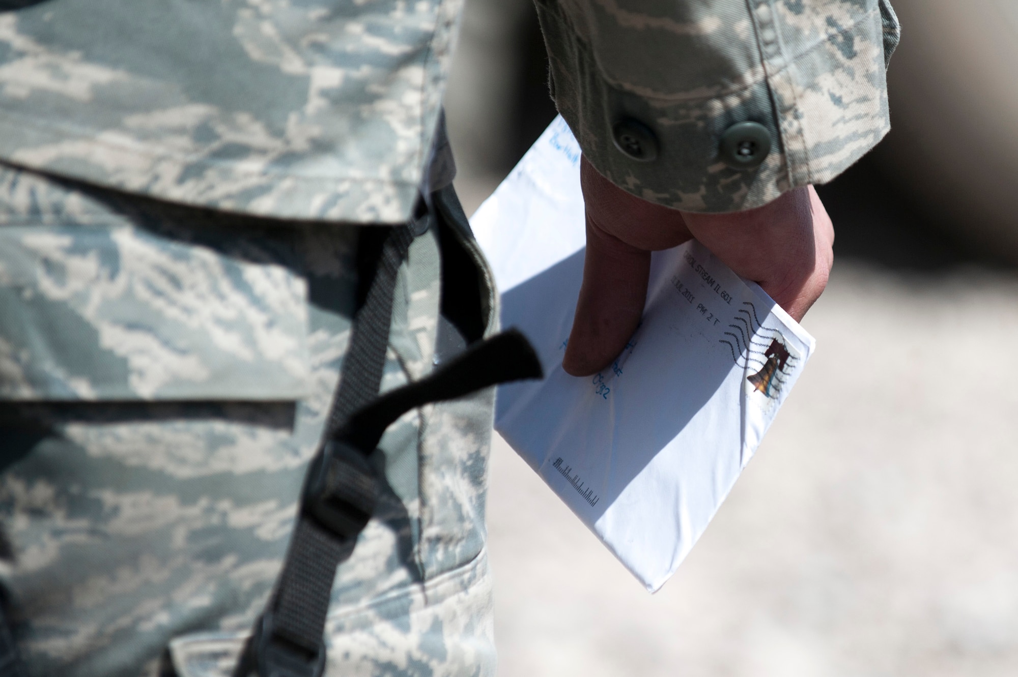 Senior Airman, Eric Miller of Detachment 1, 73rd Expeditionary Air Control Squadron holds a letter he received from back home. Mail is only delivered to a nearby base, the 73rd EACS must periodically convoy to the base in order to get the mail to their camp. Airmen eager to get their mail usually greet the returning trucks. (U.S. Air Force Photo/Master Sgt. Jeffrey Allen)