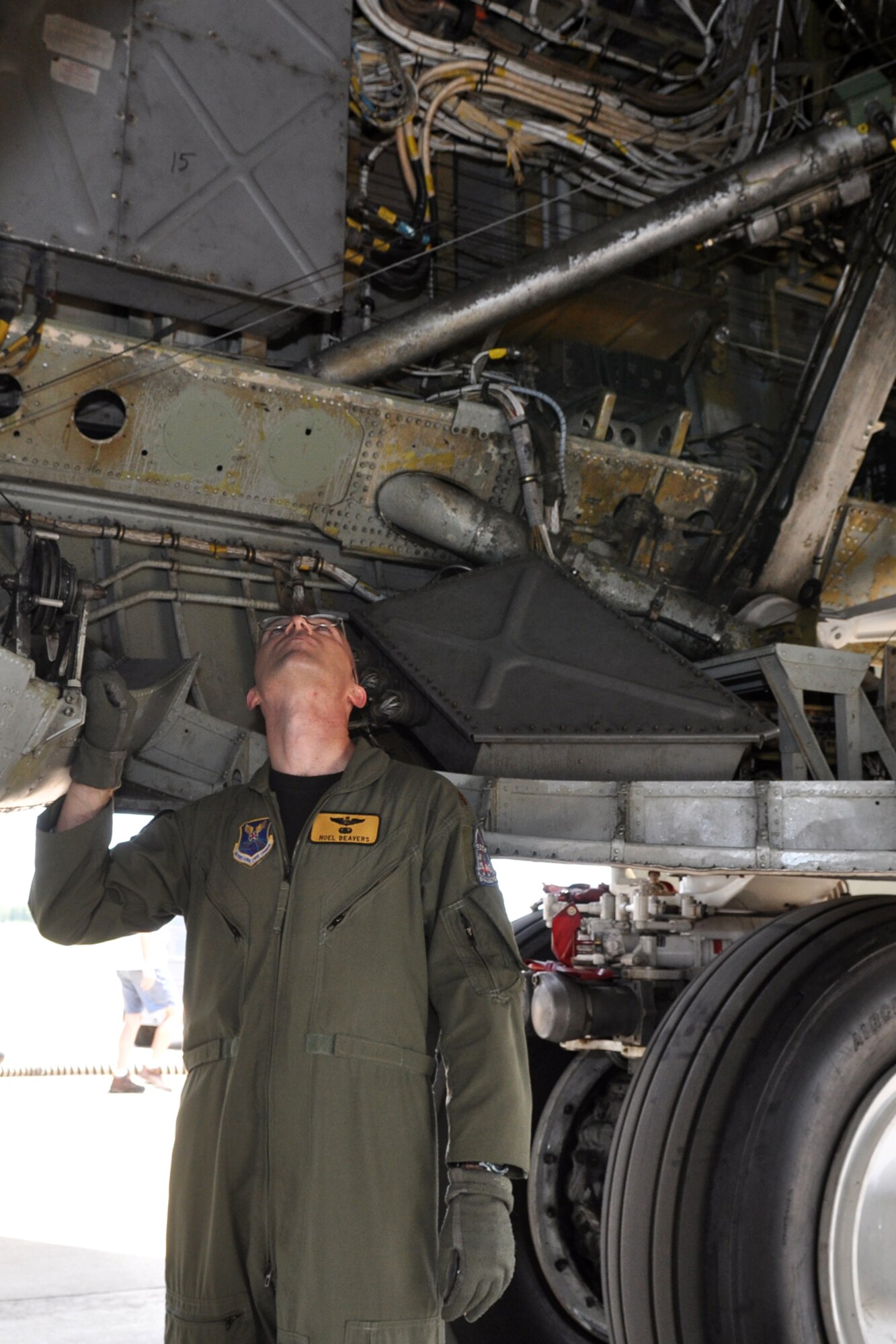 Maj. Noel Beavers, a radar navigator assigned to the 11th Bomb Squadron, performs a pre-flight check on the B-52 Stratofortress at Barksdale Air Force Base, La., July 26, 2011. Beavers is part of the 11th BS aircrew participating in the 2011 Global Strike Challenge. The competition, which is currently underway, includes bases, units and people across the country. The competition will continue through the score-posting and symposium event in November. The competition wraps up with an awards ceremony at Barksdale where trophies will be awarded to the final winners. (U.S. Air Force photo/Tech. Sgt. Jeff Walston)