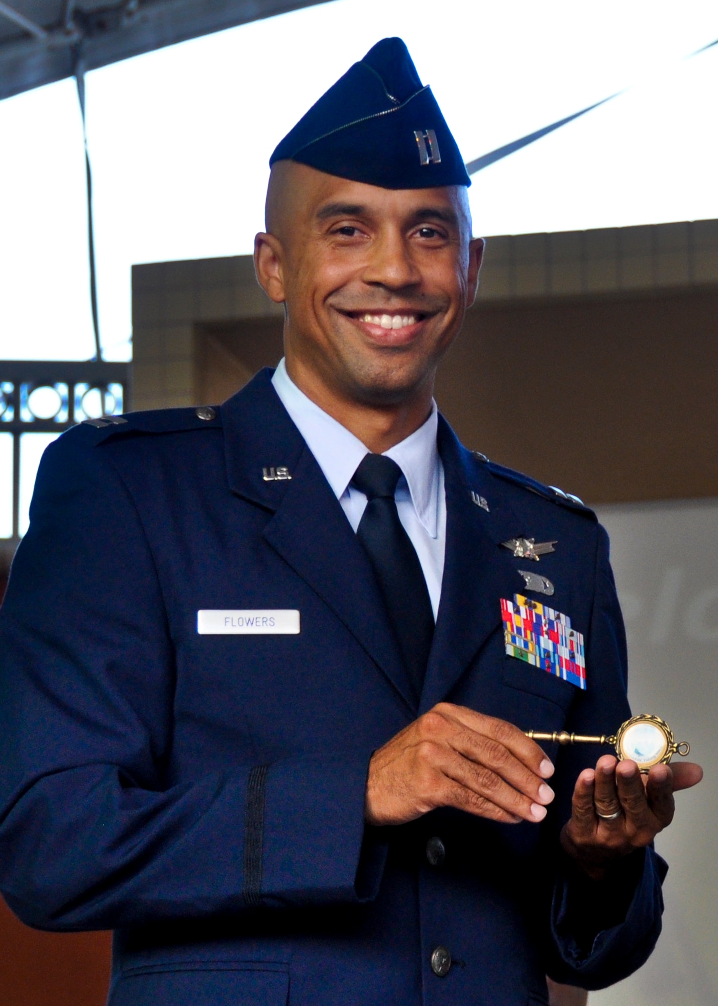Capt. Andreas Flowers, an intelligence officer with the 33rd Fighter Wing, was the second Eglin Airman to be recognized at the Red, White and Blue Celebration at the Destin HarborWalk July 28.  The third annual summer-long festivities will pay tribute to local heroes and military members from the surrounding military communities of Eglin Air Force Base, Hurlburt Field and Duke Field. Members being recognized are presented with a key to the city of Destin. (U.S. Air Force photo/Chrissy Cuttita) 