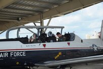 Lt. Col. John Turnipseed(left), 559th Flying Training Squadron instructor pilot and Air Force Academy Cadet Arturas Kucharevas, a foreign exchange student from Lithuania, perform final checks  before his orientation flight in the T-6 Texan II aircraft at Randolph Air Force Base July 19. (U.S. Air Force photo/Rich McFadden) (released)
