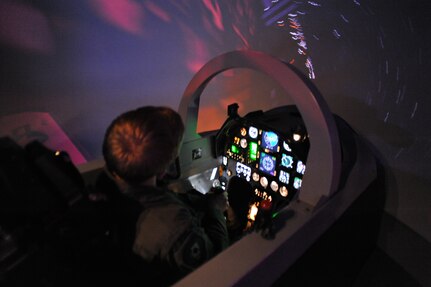 Air Force Academy Cadet   Cole Vonohlen learns how to fly the T-6 simulator on Randolph Air Force Base July 15. (U.S. Air Force photo/Rich McFadden) (released)