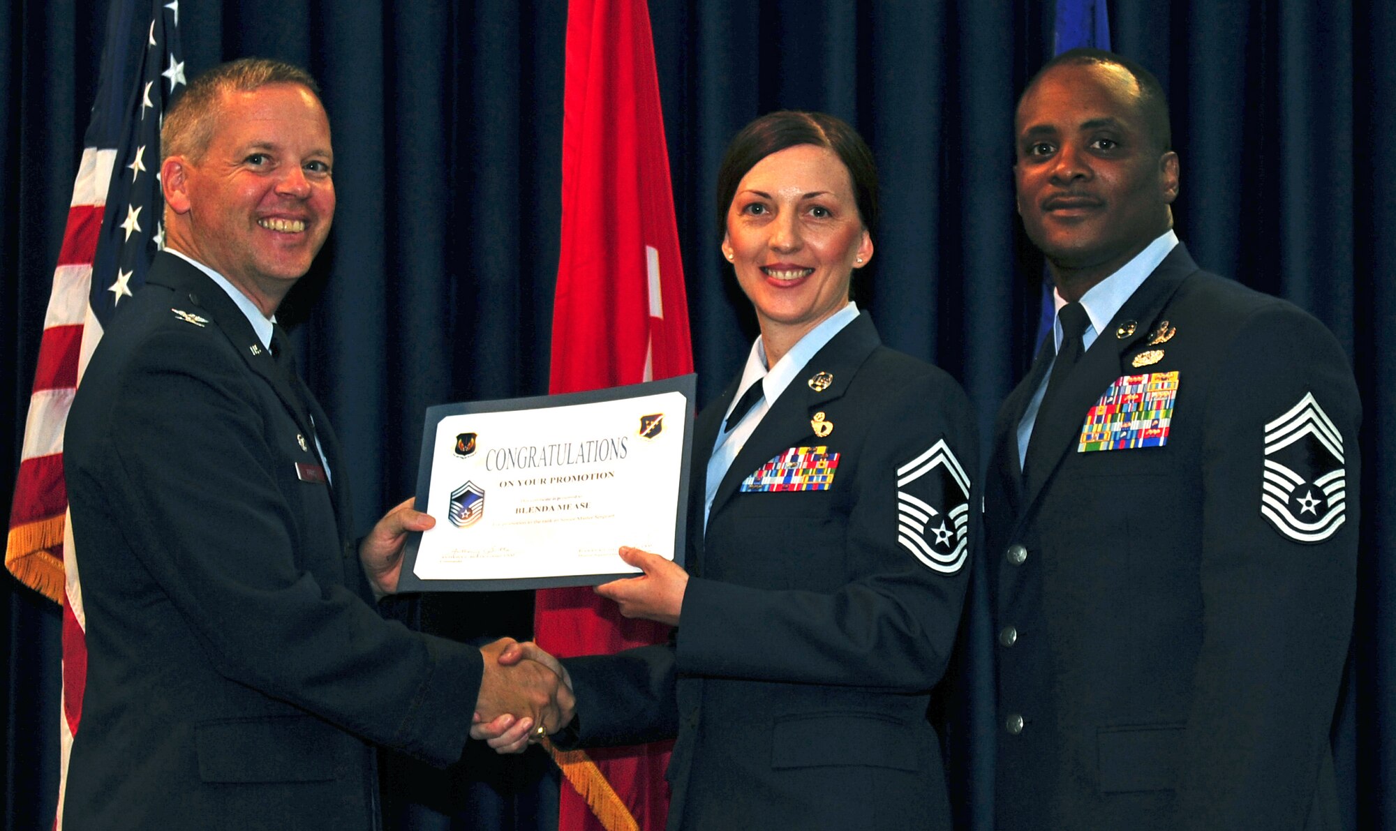 Blenda Mease, 728th Air Mobility Squadron, is promoted to the rank of senior master sergeant July 29, 2011, at the Club Complex ballroom at Incirlik Air Base, Turkey. (U.S. Air Force photo by Senior Airman Anthony Sanchelli/Released)