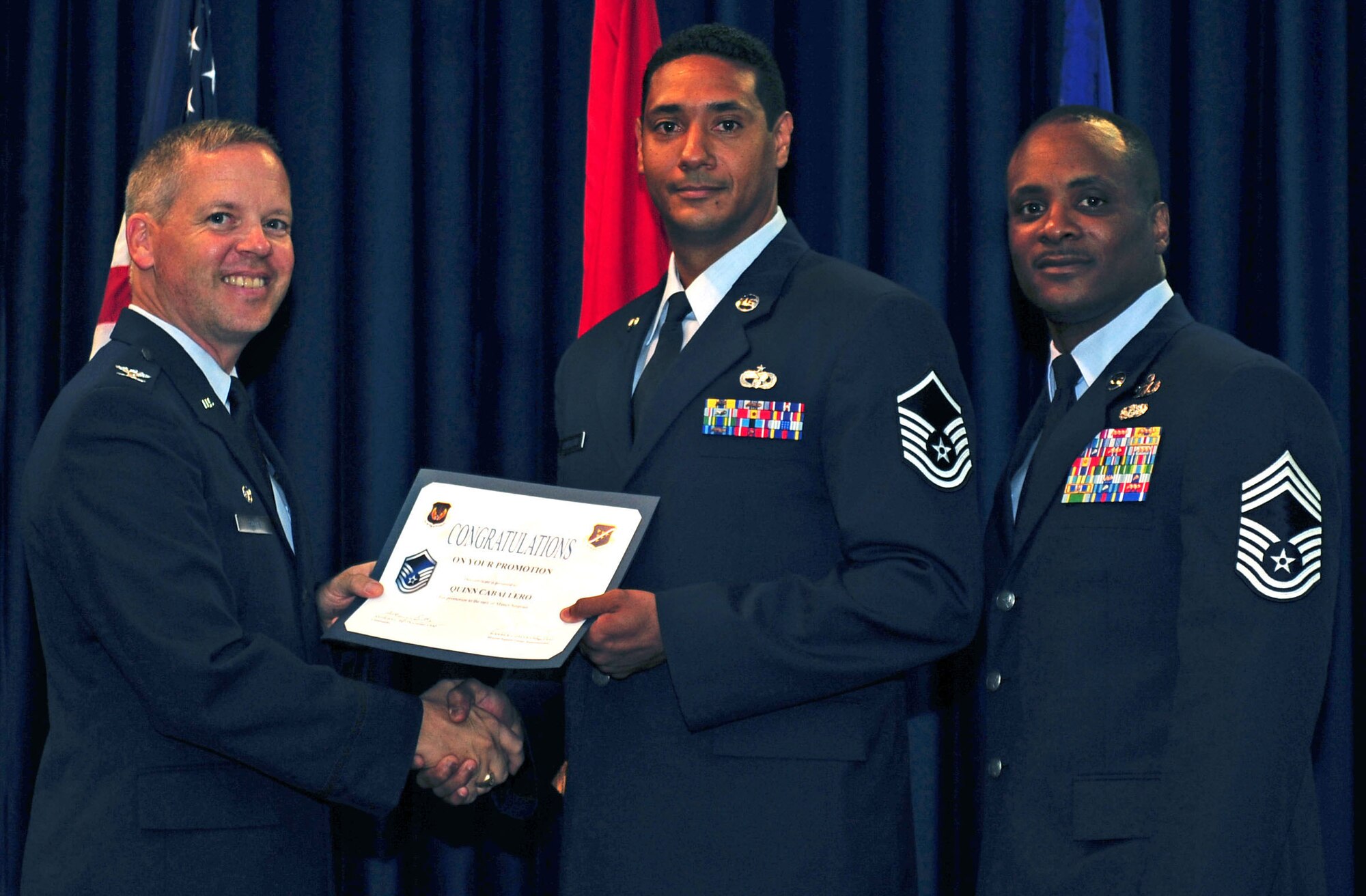 Quinn Caballero, 728th Air Mobility Squadron, is promoted to the rank of master sergeant July 29, 2011, at the Club Complex ballroom at Incirlik Air Base, Turkey. (U.S. Air Force photo by Senior Airman Anthony Sanchelli/Released)