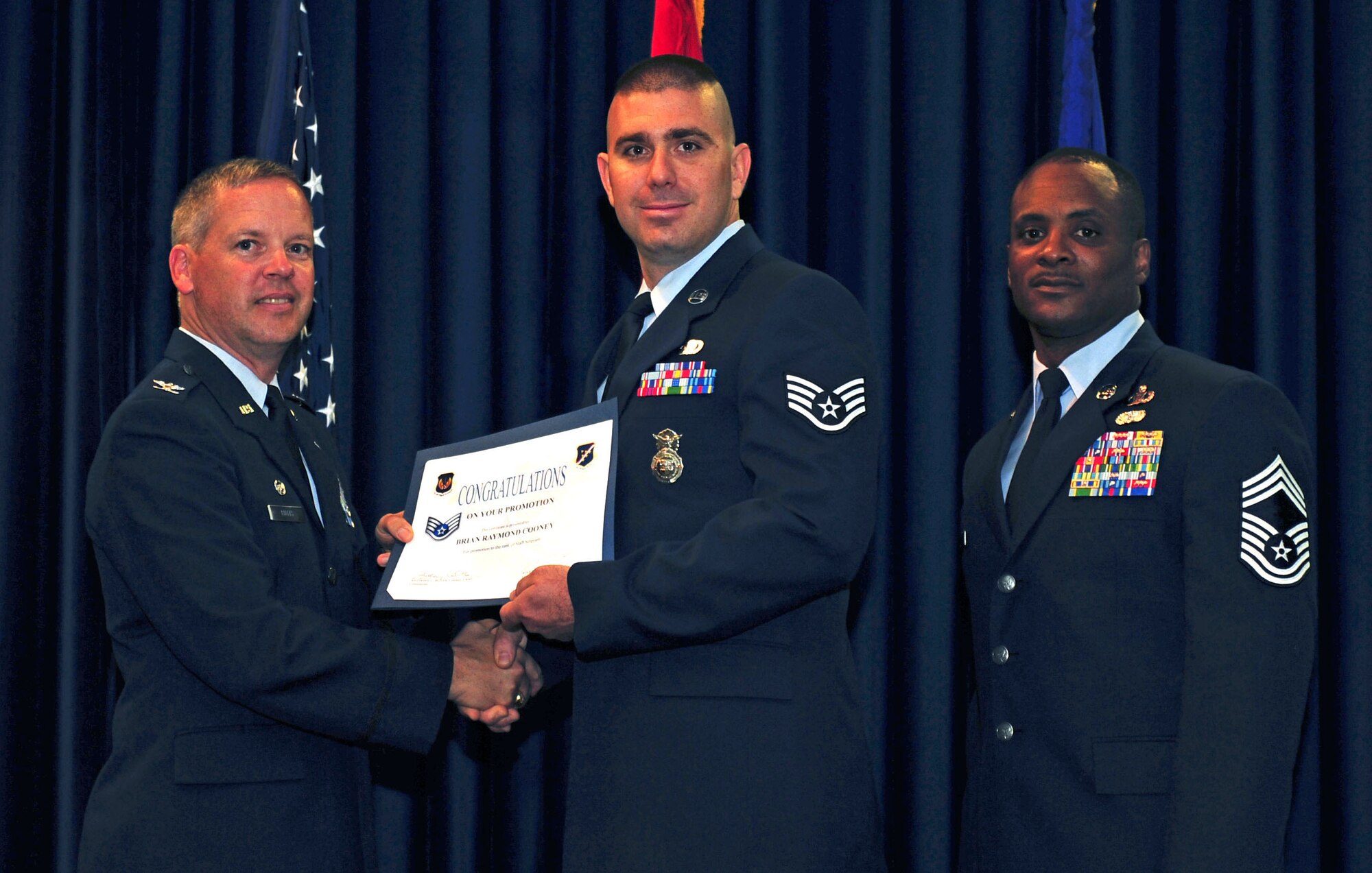 Brian Cooney, 39th Security Forces Squadron, is promoted to the rank of staff sergeant July 29, 2011, at the Club Complex ballroom at Incirlik Air Base, Turkey. (U.S. Air Force photo by Senior Airman Anthony Sanchelli/Released)
