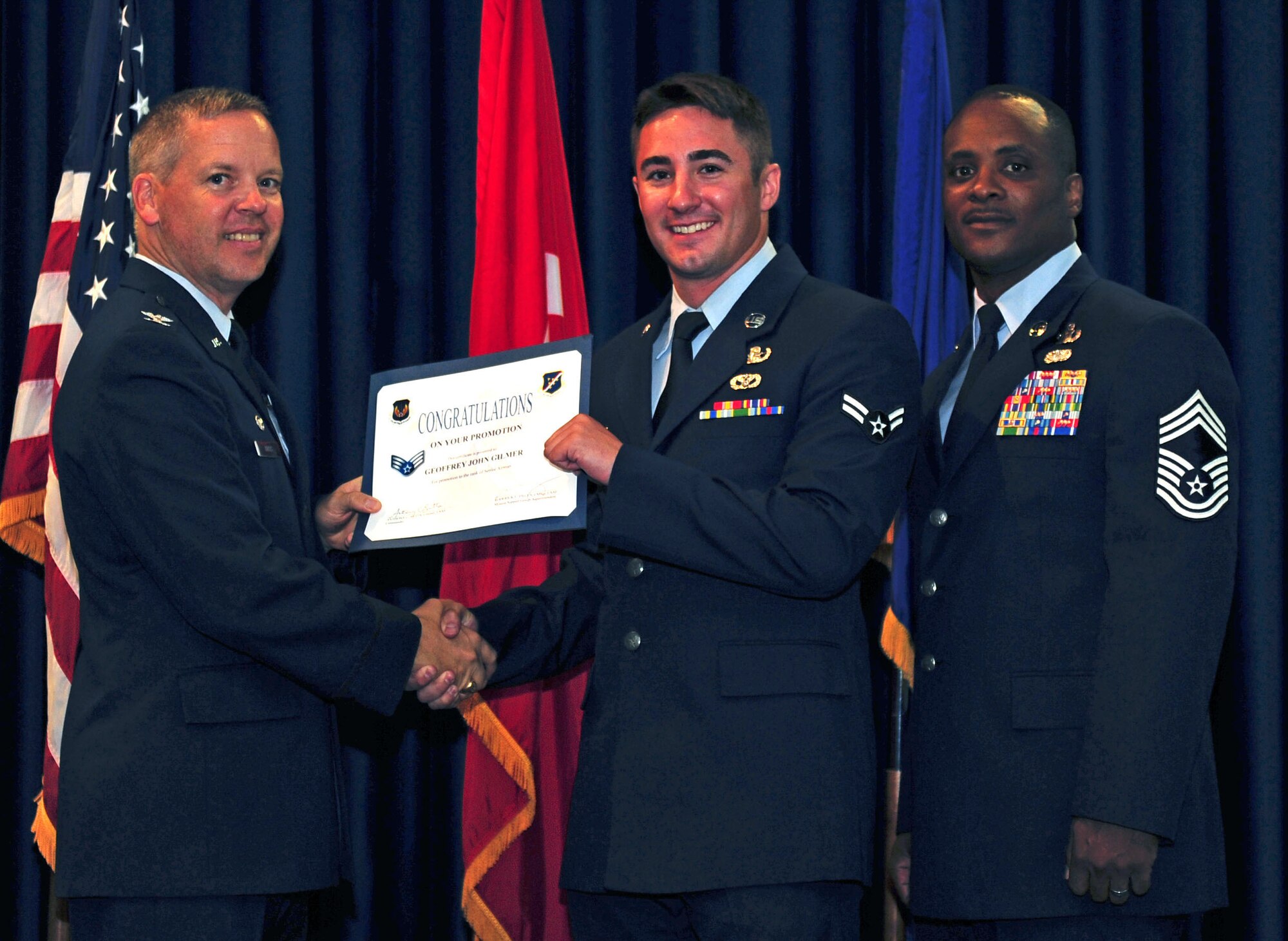 Geoffrey Gilmer, 39th Civil Engineer Squadron, is promoted to the rank of senior airman July 29, 2011, at the Club Complex ballroom at Incirlik Air Base, Turkey. (U.S. Air Force photo by Senior Airman Anthony Sanchelli/Released)

