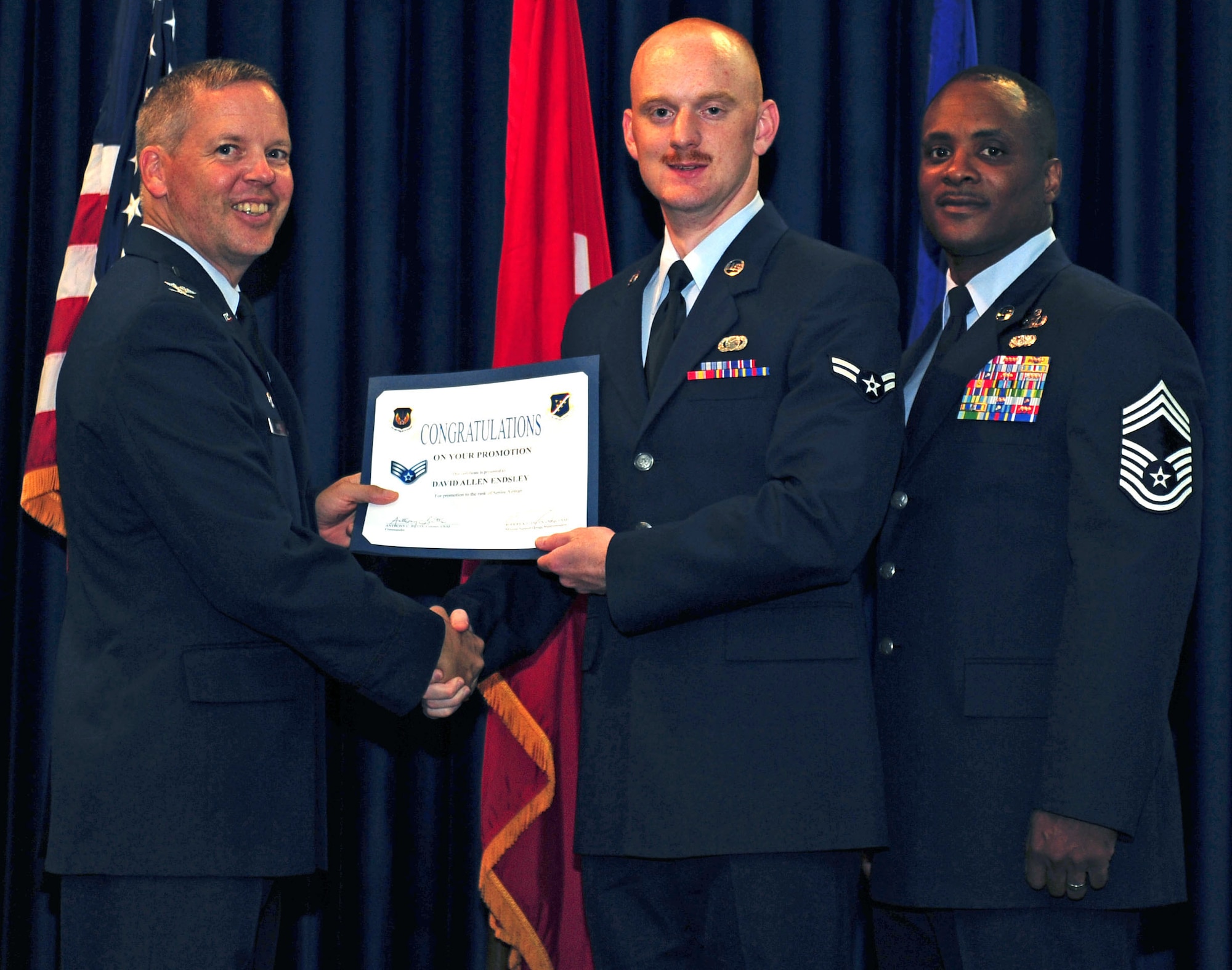 Clayton Lenhardt, 39th Air Base Wing Staff Agencies, is promoted to the rank of senior airman July 29, 2011, at the Club Complex ballroom at Incirlik Air Base, Turkey. (U.S. Air Force photo by Senior Airman Anthony Sanchelli/Released)
