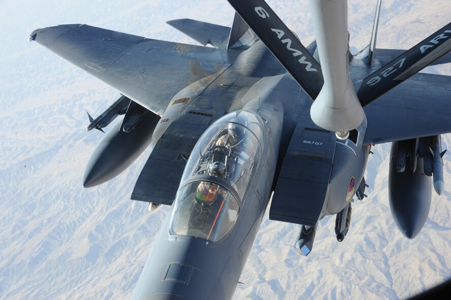 A KC-135 Stratotanker deployed to the 22nd Expeditionary Air Refueling Squadron at the Transit Center at Manas, Kyrgyzstan, refuels an F-15E deployed from Mountain Home Air Force Base, Idaho, July 30, 2011. This refuel was part of a mission that earned Maj. Joshua Brown, 22nd EARS pilot deployed from the 93rd Air Refueling Squadron at Fairchild AFB, his 18th oak leaf cluster for the Air Medal.  (U.S. Air Force photo/Tech. Sgt. Hank Hoegen)