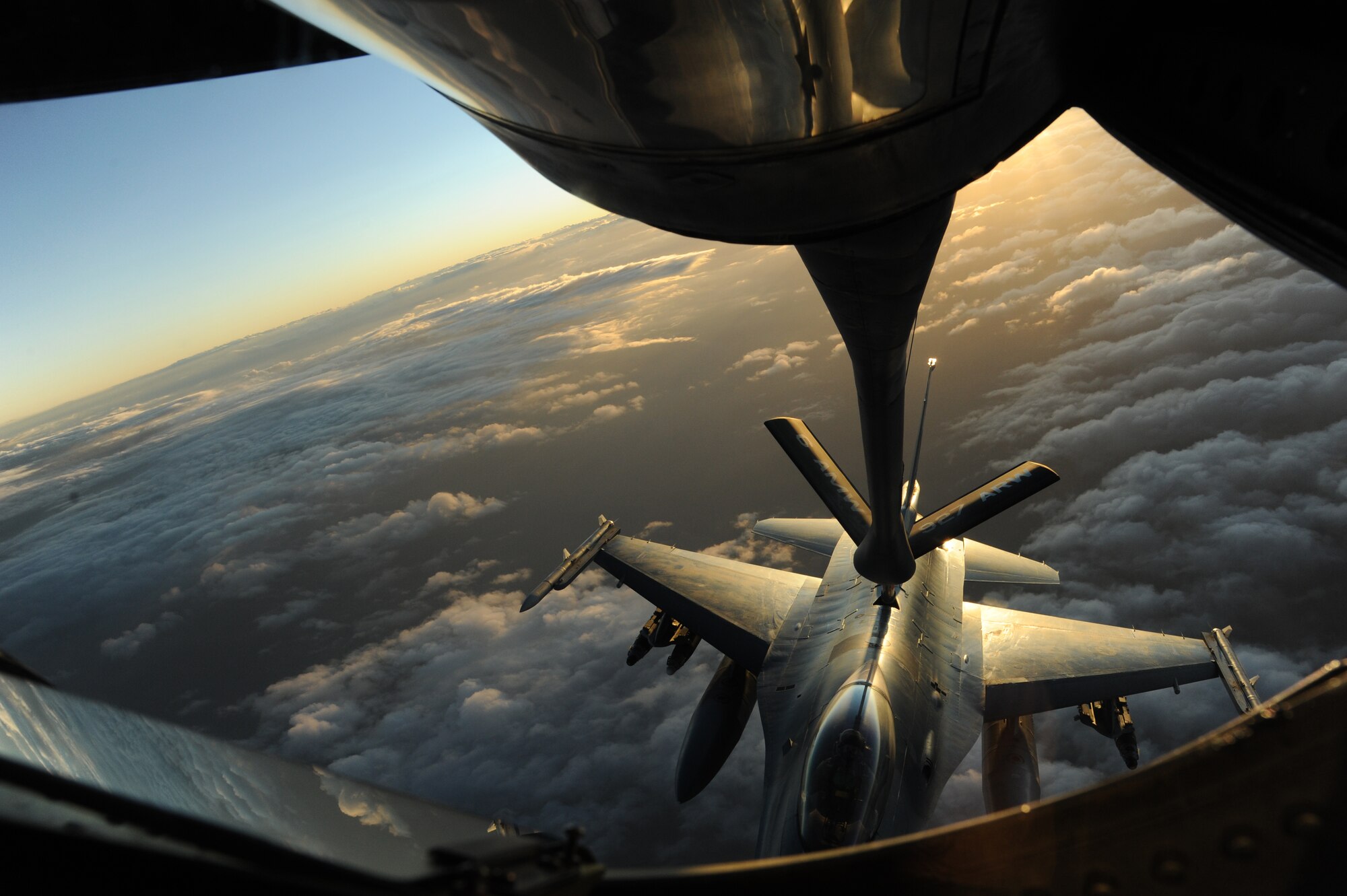 A KC-135 Stratotanker deployed to the 22nd Expeditionary Air Refueling Squadron at the Transit Center at Manas, Kyrgyzstan, refuels an F-16 deployed from Aviano Air Base, Italy, July 30, 2011. This refuel was part of a mission that earned Maj. Joshua Brown, 22nd EARS pilot deployed from the 93rd Air Refueling Squadron at Fairchild AFB, his 18th oak leaf cluster for the Air Medal.  (U.S. Air Force photo/Tech. Sgt. Hank Hoegen)