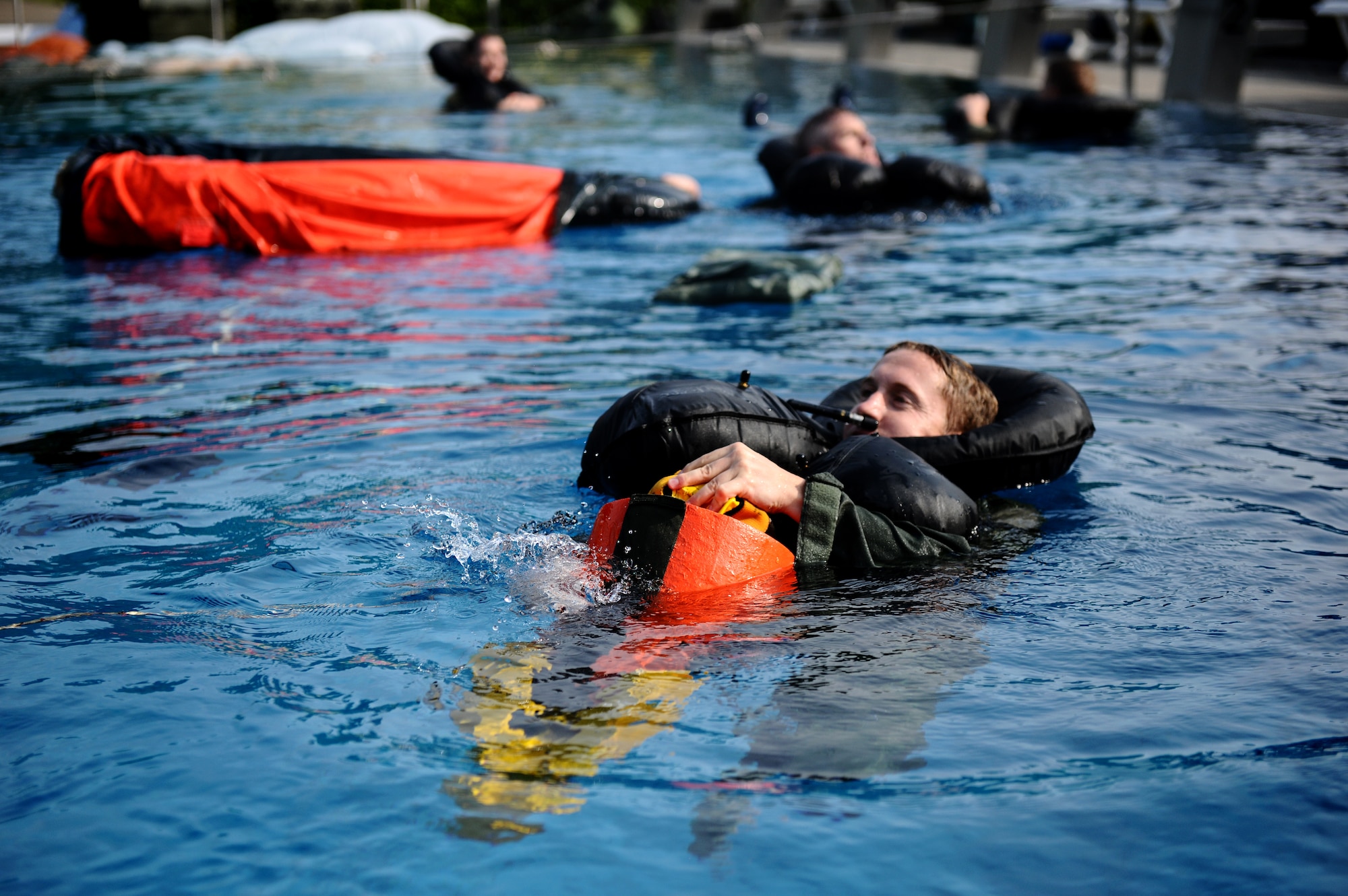 SPANGDAHLEM AIR BASE, Germany -- Capt. Brent Fleming, 81st Fighter Squadron A-10 Thunderbolt II pilot, straps himself to a rescue recovery device during water survival training here July 29. Water survival training is a triennial requirement for pilots. (U.S. Air Force photo/Staff Sgt. Nathanael Callon)