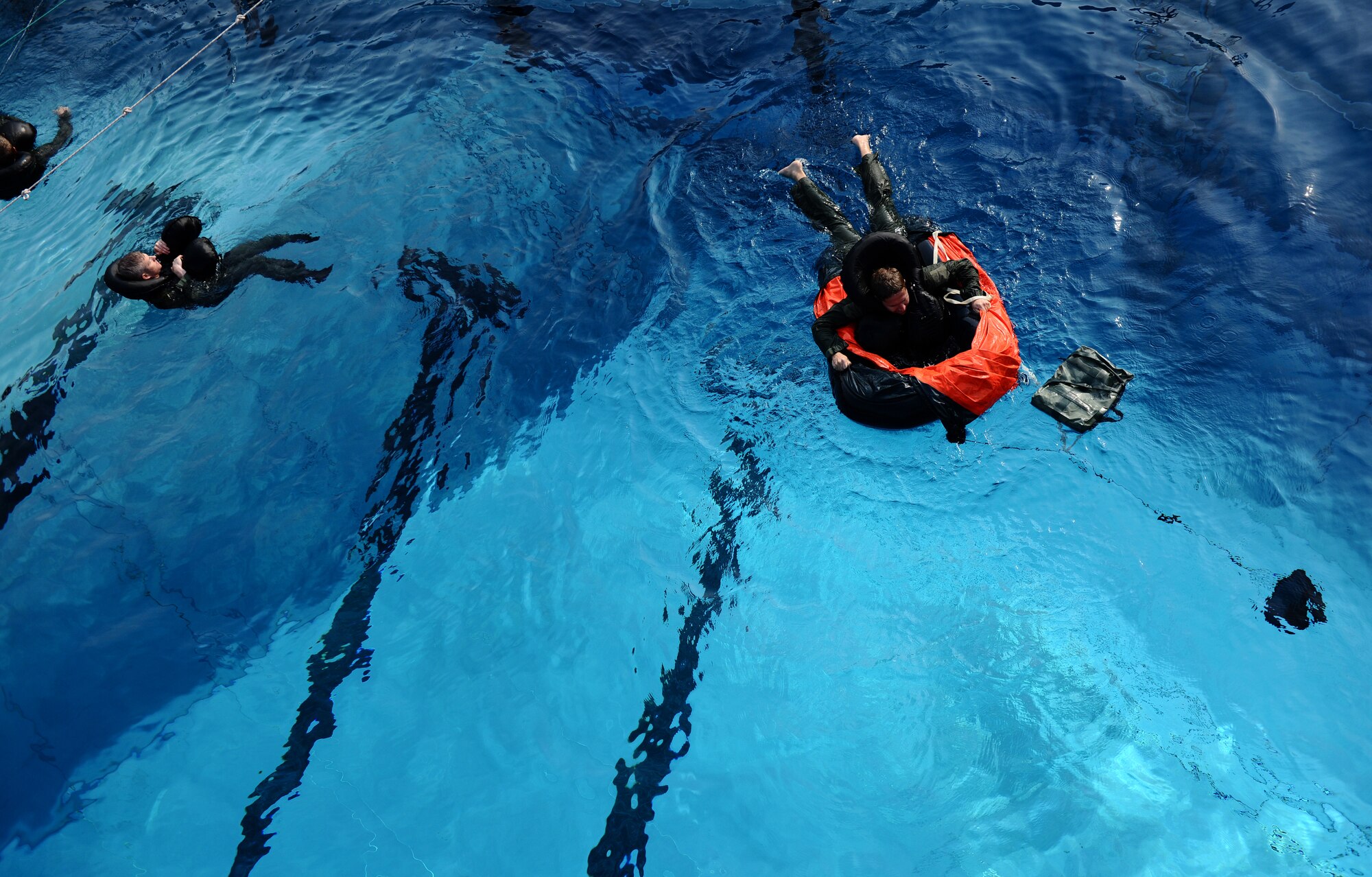 SPANGDAHLEM AIR BASE, Germany -- Pilots from the 81st Fighter Squadron perform tasks during water survival training here July 29. Water survival training is a triennial requirement for pilots. (U.S. Air Force photo/Staff Sgt. Nathanael Callon)