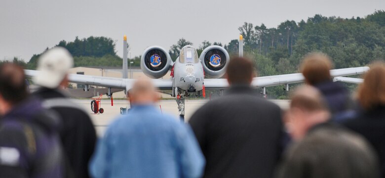 SPANGDAHLEM AIR BASE, Germany – Spectators take photos of an A10 Thunderbolt II from the 81st Fighter Squadron as it undergoes maintenance before a capabilities demonstration at the Spangdahlem Air Base Open House 2011 here July 31. About 40,000 people  visited the base to view aircraft and learn about the mission capabilities of the 52nd Fighter Wing and NATO partners. (U.S. Air Force photo/Senior Airman Nick Wilson)