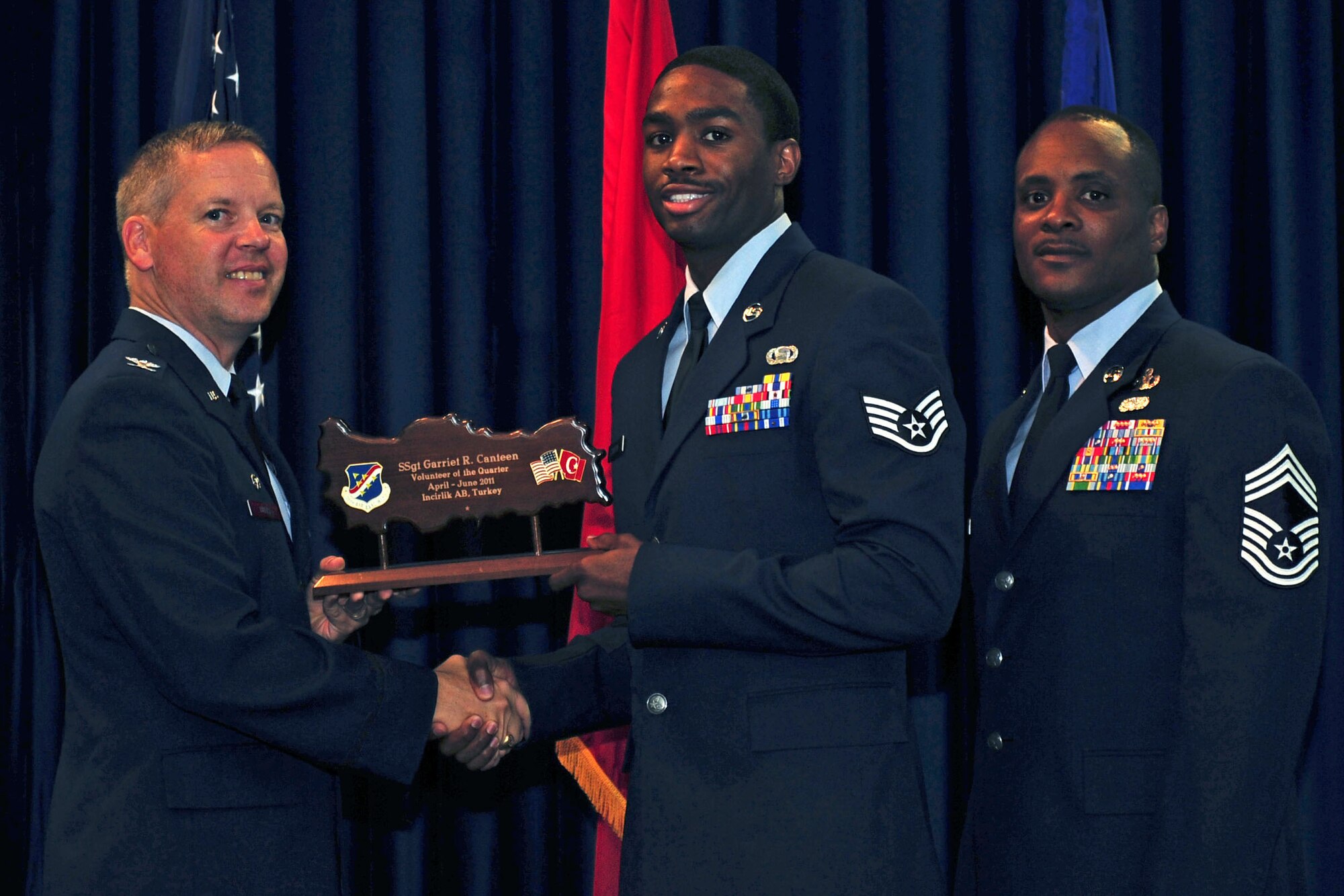 Staff Sgt. Garriet Canteen, 39th Operations Squadron, receives the Volunteer of the Quarter Award July 29, 2011, at the Club Complex ballroom at Incirlik Air Base, Turkey. (U.S. Air Force photo by Senior Airman Anthony Sanchelli/Released)
