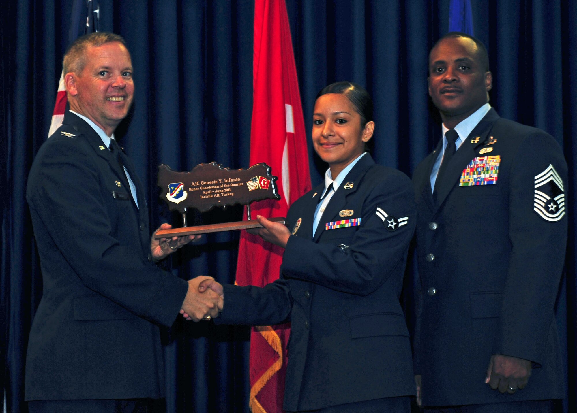 Airman 1st Class Genesis Infante, 39th Security Forces Squadron, receives the Honor Guardsman of the Quarter Award July 29, 2011, at the Club Complex ballroom at Incirlik Air Base, Turkey. (U.S. Air Force photo by Senior Airman Anthony Sanchelli/Released)
