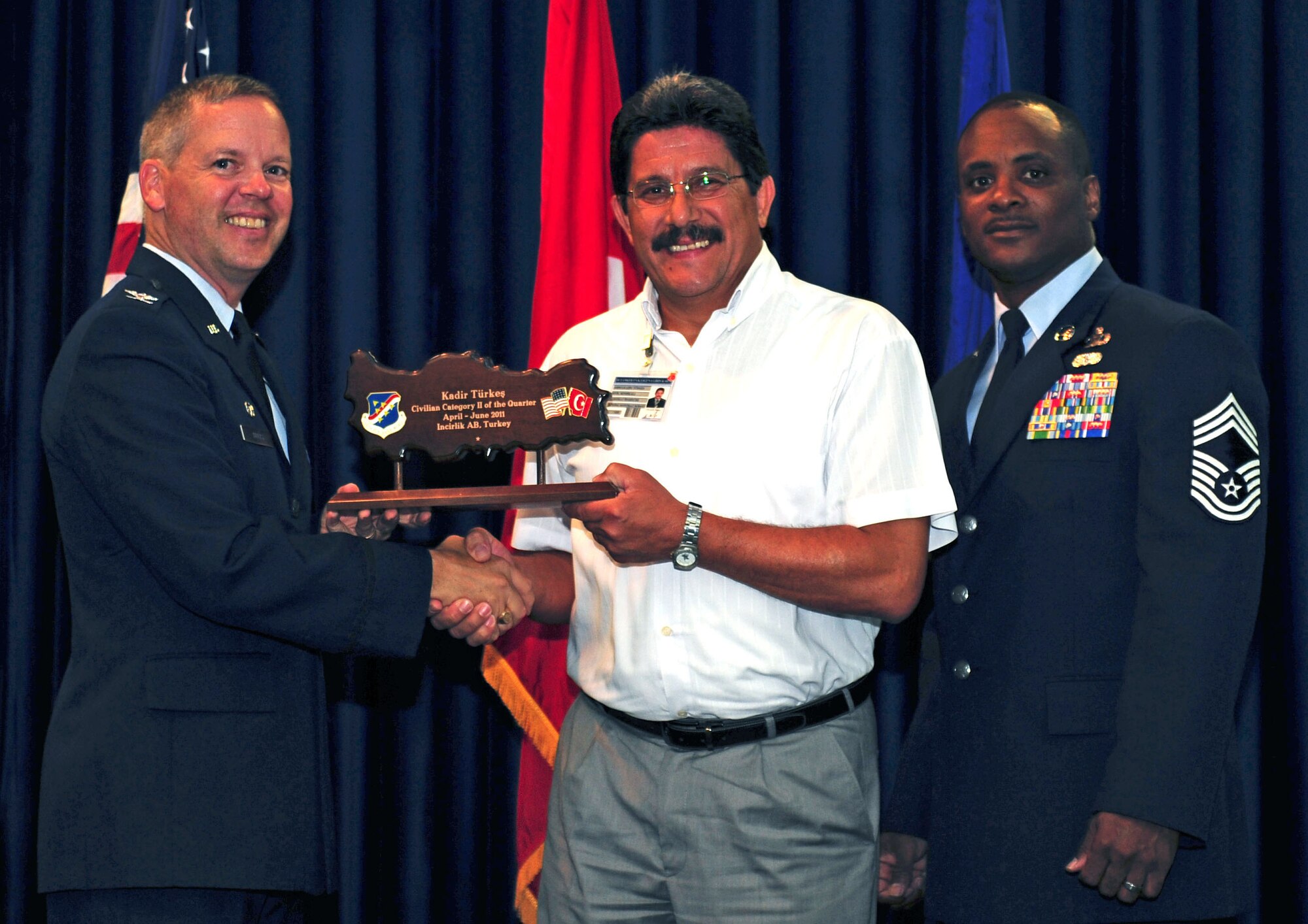 Kadir Turkes, 39th Contracting Squadron, receives the wing-level Civilian Category Two of the Quarter Award July 29, 2011, at the Club Complex ballroom at Incirlik Air Base, Turkey. (U.S. Air Force photo by Senior Airman Anthony Sanchelli/Released)
