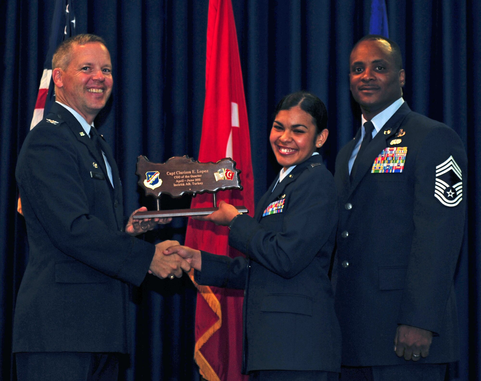 Capt. Clarissa Lopez, 39th Contracting Squadron, receives the wing-level Company Grade Officer of the Quarter Award July 29, 2011, at the Club Complex ballroom at Incirlik Air Base, Turkey. (U.S. Air Force photo by Senior Airman Anthony Sanchelli/Released)
