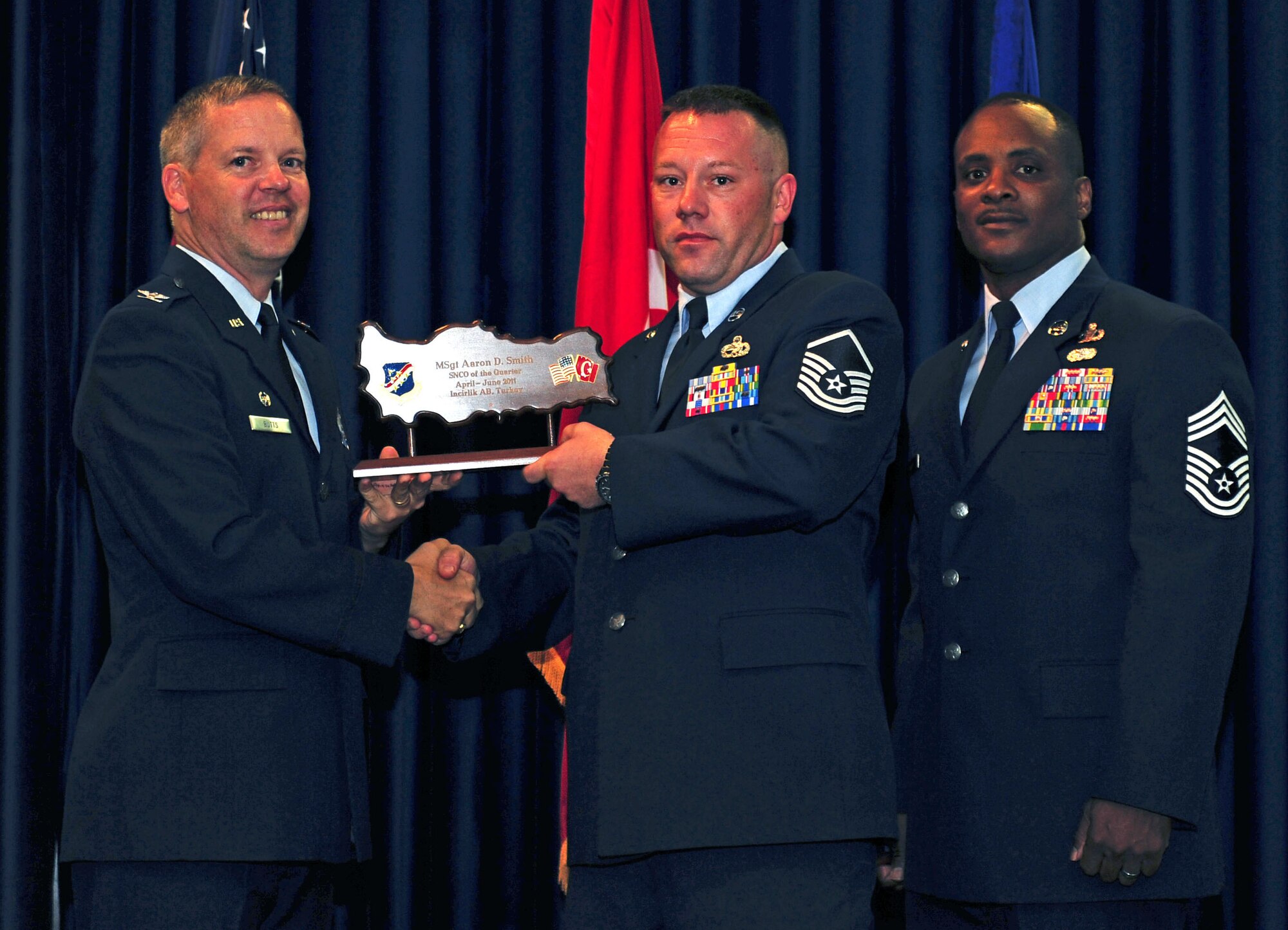 Master Sgt. Aaron Smith, 39th Maintenance Squadron, receives the wing-level Senior NCO of the Quarter Award July 29, 2011, at the Club Complex ballroom at Incirlik Air Base, Turkey. (U.S. Air Force photo by Senior Airman Anthony Sanchelli/Released)
