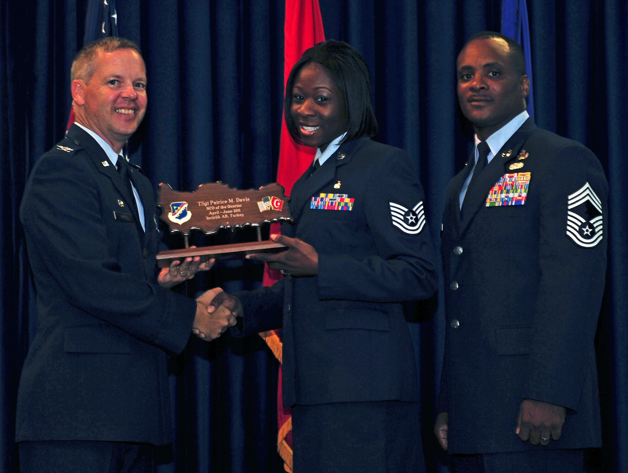 Tech. Sgt. Patrice Davis, 39th Medical Operations Squadron, receives the wing-level NCO of the Quarter Award July 29, 2011, at the Club Complex ballroom at Incirlik Air Base, Turkey. (U.S. Air Force photo by Senior Airman Anthony Sanchelli/Released)

