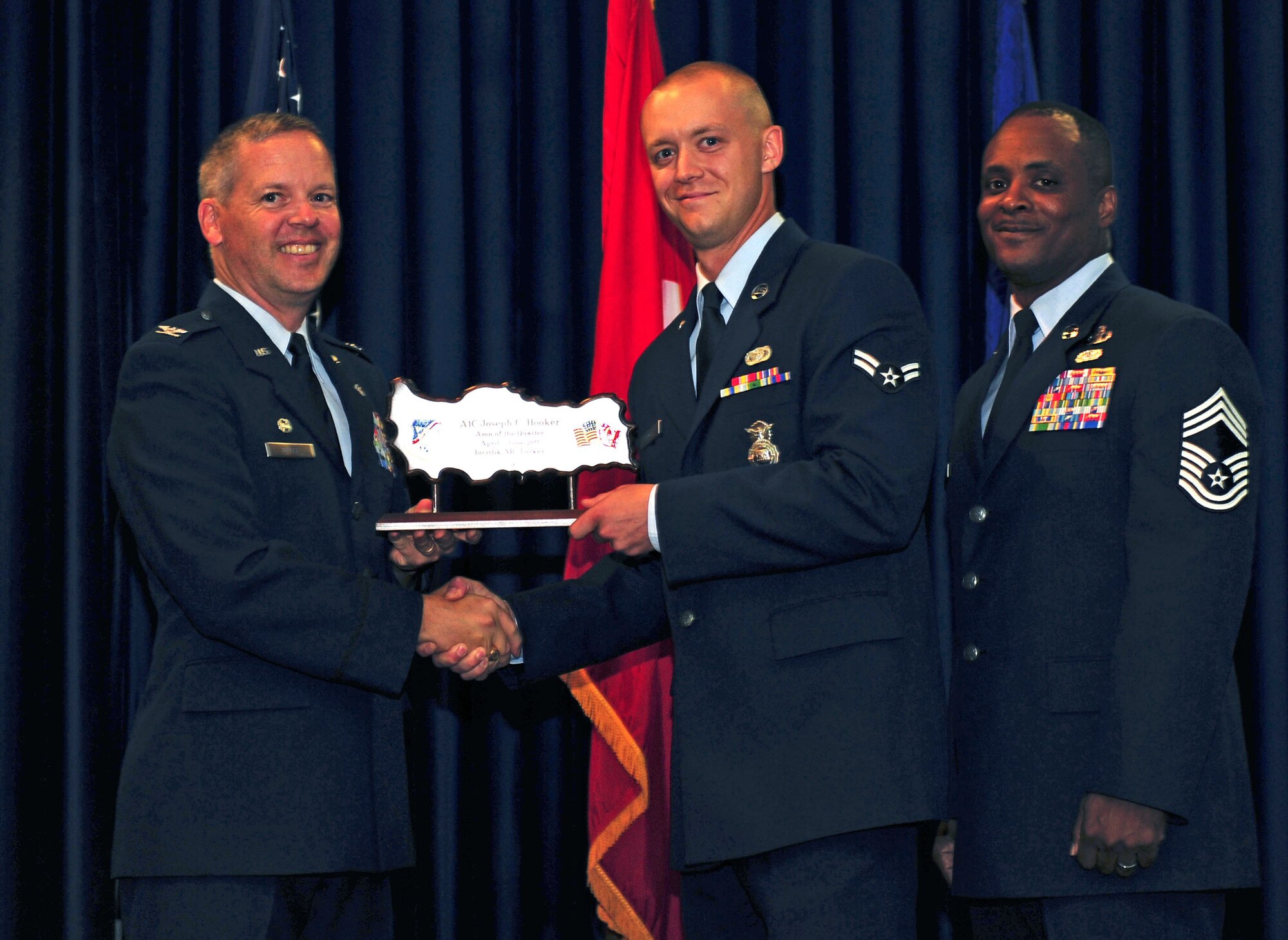 Airman 1st Class Joseph Hooker, 39th Security Forces Squadron, receives the wing-level Airman of the Quarter Award July 29, 2011, at the Club Complex ballroom at Incirlik Air Base, Turkey. (U.S. Air Force photo by Senior Airman Anthony Sanchelli/Released)
