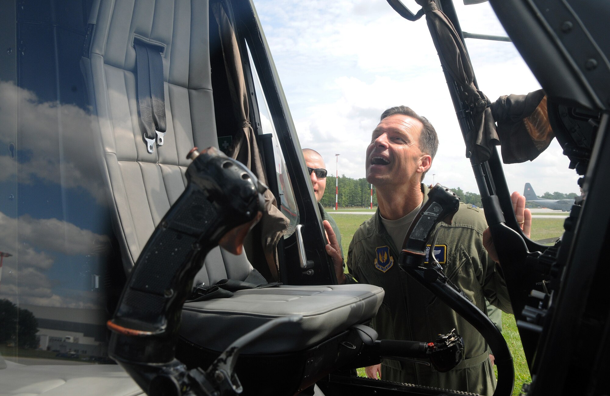 Brig. Gen. Mark Dillon, 86th Airlift Wing commander, admires the inside of a Polish air force Mi-series helicopter during a visit to Powidz Air Base, Poland, July 26, 2011. Dillon made his annual visit to Powidz after signing a letter of intention last year in June. By singing the letter of intention, the 86th AW and the 3rd AW became "sister wings" in an effort to improve operational capabilities. (U.S.  Air Force photo by Staff Sgt. Tyrona Lawson). 