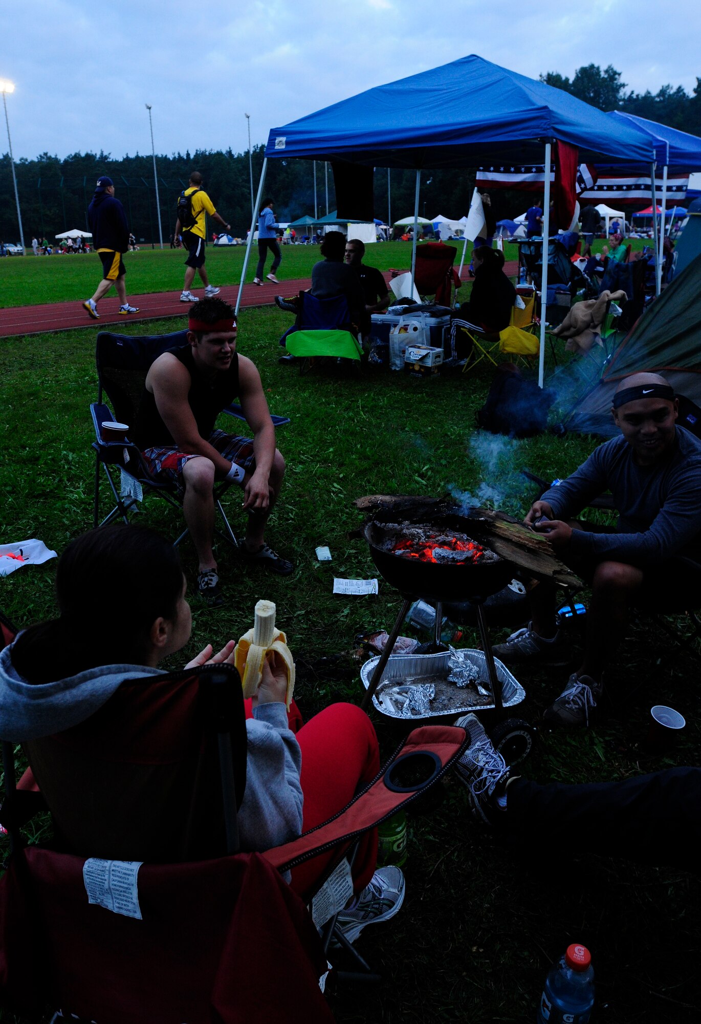 KMC Viking Challenge participants from the 693rd Intelligence Support Squadron unwind after their run, Pulaski Barracks, Germany, July 30, 2011. More than 1,000 KMC members took part in the 24-hour event hosted by the KMC 5/6 Club. This year, the club plans to donate funds to both Fisher Houses on Landstuhl Regional Medical Center. (U.S. Air Force photo by Airman 1st Class Desiree Esposito)