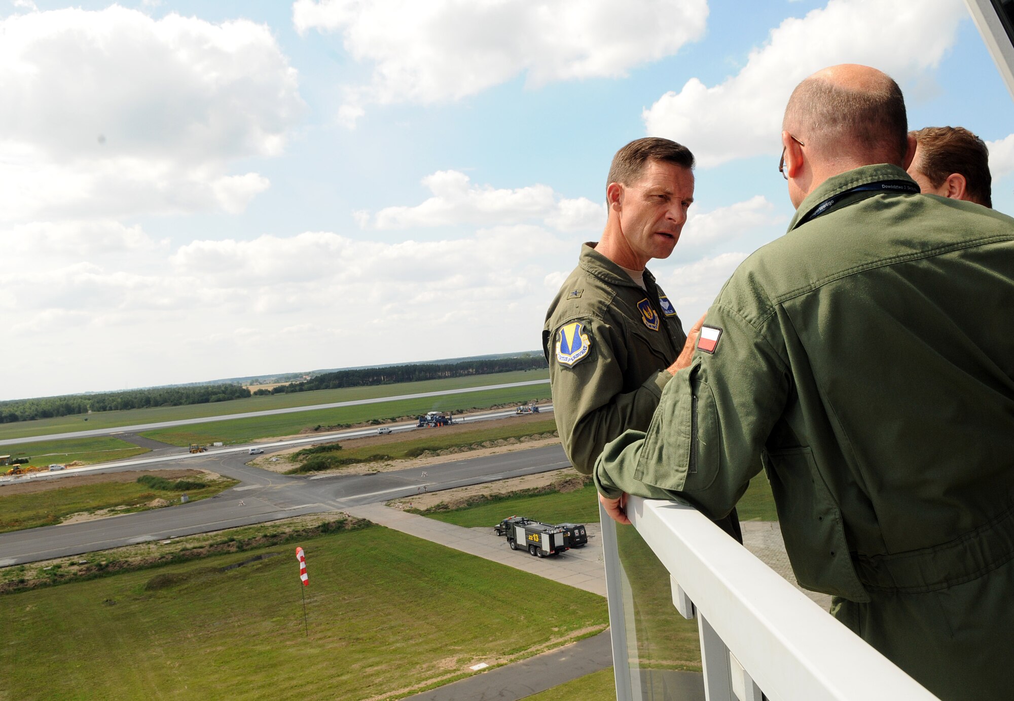 Brig. Gen. Mark Dillon, 86th Airlift Wing commander, and Polish air force Col. pil. Slawomir Zakowski, 3rd Airlift Wing commander, tour the control tower and view the airfield during a visit to Powidz Air Base, Poland, July 26, 2011. Dillon made his annual visit to Powidz after signing a letter of intention last year in June. By singing the letter of intention, the 86th AW and the 3rd AW became "sister wings" in an effort to improve operational capabilities. (U.S.  Air Force photo by Staff Sgt. Tyrona Lawson). 