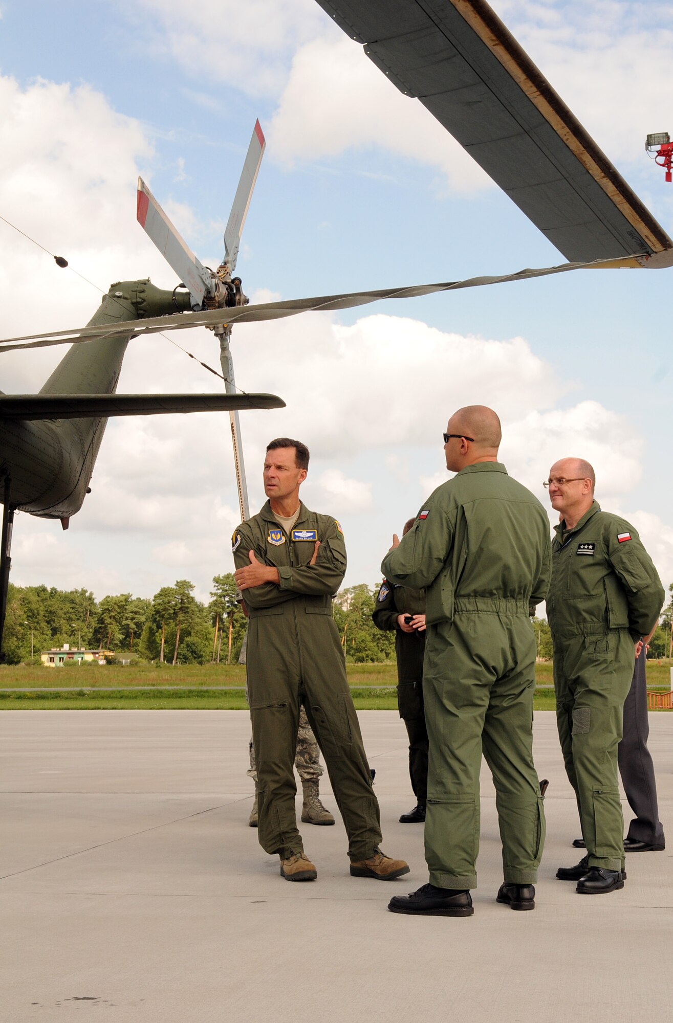 Brig. Gen. Mark Dillon, 86th Airlift Wing commander, along with Polish air force Col. pil. Slawomir Zakowski, 3rd Airlift Wing commander, receives a tour of one of the many aircraft utilized by the 3rd Airlift, July 26, 2011, Powidz Air Base, Poland. During his visit to the “sister wing”, Gen. Dillon also toured the new control tower and a new hanger built for C-130 aircraft maintenance. (U.S.  Air Force photo by Staff Sgt. Tyrona Lawson). 