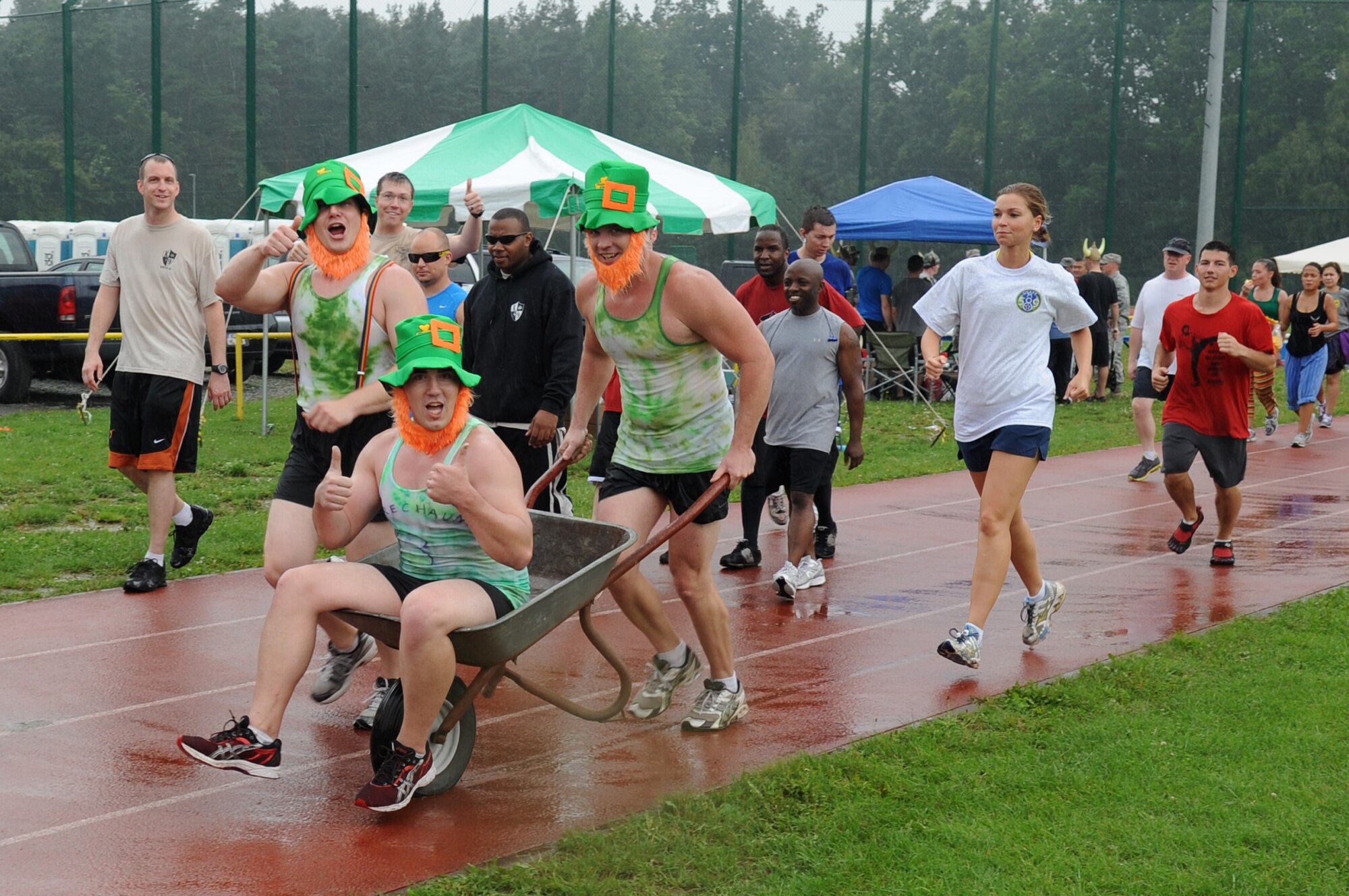 Participants make their way around the track at Pulaski Barracks during the annual KMC Viking Challenge, July 30, 2011. More than 1,000 KMC members took part in the 24-hour event hosted by the KMC 5/6 Club. This year, the club plans to donate funds to both Fisher Houses on Landstuhl Regional Medical Center. (U.S. Air Force photo by Senior Airman Brittany Perry)