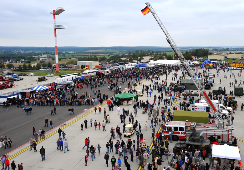 SPANGDAHLEM AIR BASE, Germany – Visitors enjoy the displays at the Spangdahlem Air Base Open House here July 31. The 52nd Fighter Wing welcomed about 40,000 visitors from across Europe who visited the base and learned about daily operations. (U.S. Air Force photo/Airman 1st Class Dillon Davis)