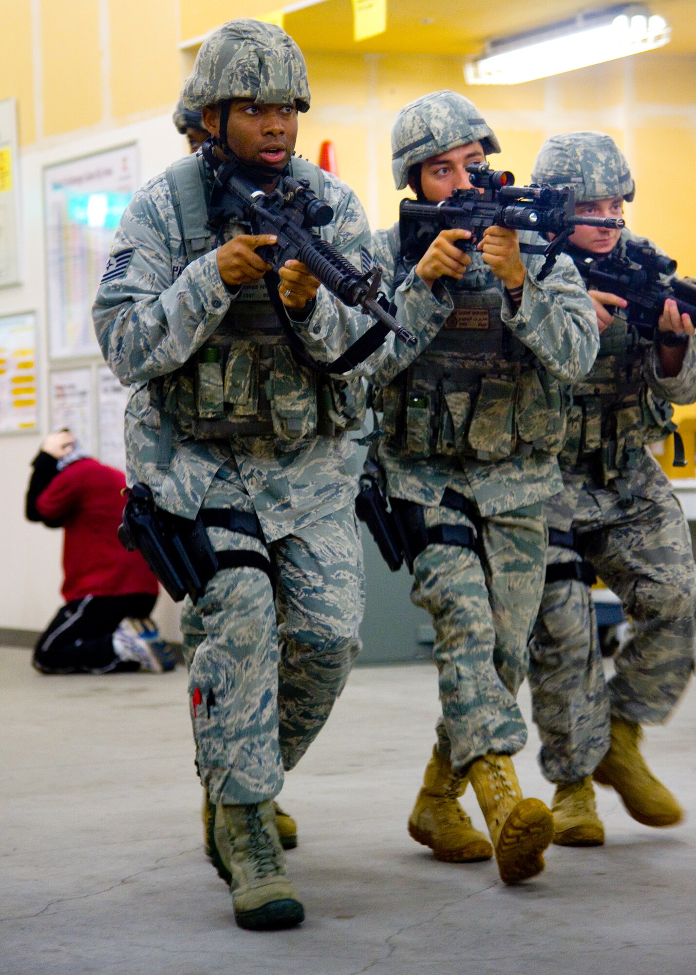 YOKOTA AIR BASE, Japan -- Airmen from the 374th Security Forces Squadron sweep through the Base Exchange during a simulated active shooter response scenario at Yokota Air Base, Japan, July 27, 2011. The scenario was part of the Pacific Air Force's High Risk Response Training course and taught base security forces members how to respond quickly to an active shooter incident and other threats. (U.S. Air Force photo/Airman 1st Class Andrea Salazar)
