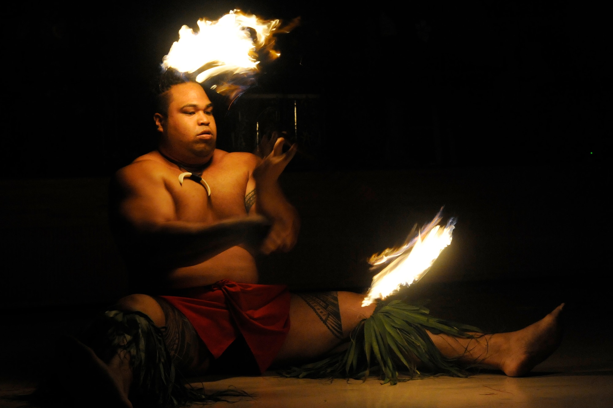 MISAWA AIR BASE, Japan -- Arthur Tupuola, Ma'ohi Nui dancer, performs the Samoan fire knife dance during the Luau held at the Misawa Collocated Club July 29. Ma'ohi Nui performed at Misawa as part of an Armed Forces Entertainment tour in support of military members and their families.  (U.S. Air Force photo/Staff Sgt. Marie Brown/Released)