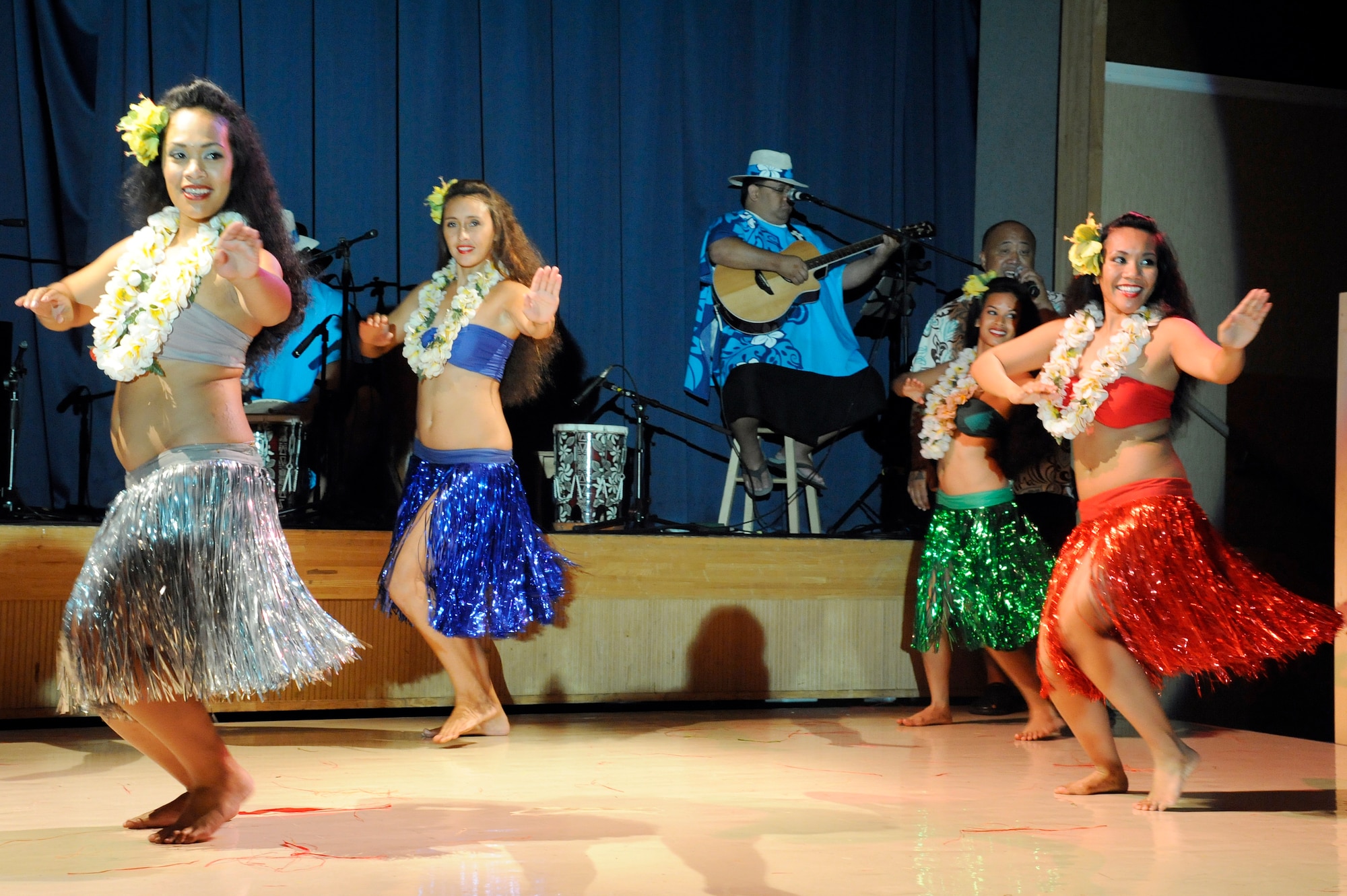 MISAWA AIR BASE, Japan -- The female dancers for Ma'ohi Nui perform a traditional Polynesian dance during the Luau held at the Misawa Collocated Club July 29. The performance included singing and dancing from the islands of Polynesia, Hawaii, Tahiti, Samoa and Tonga. (U.S. Air Force photo/Staff Sgt. Marie Brown/Released)