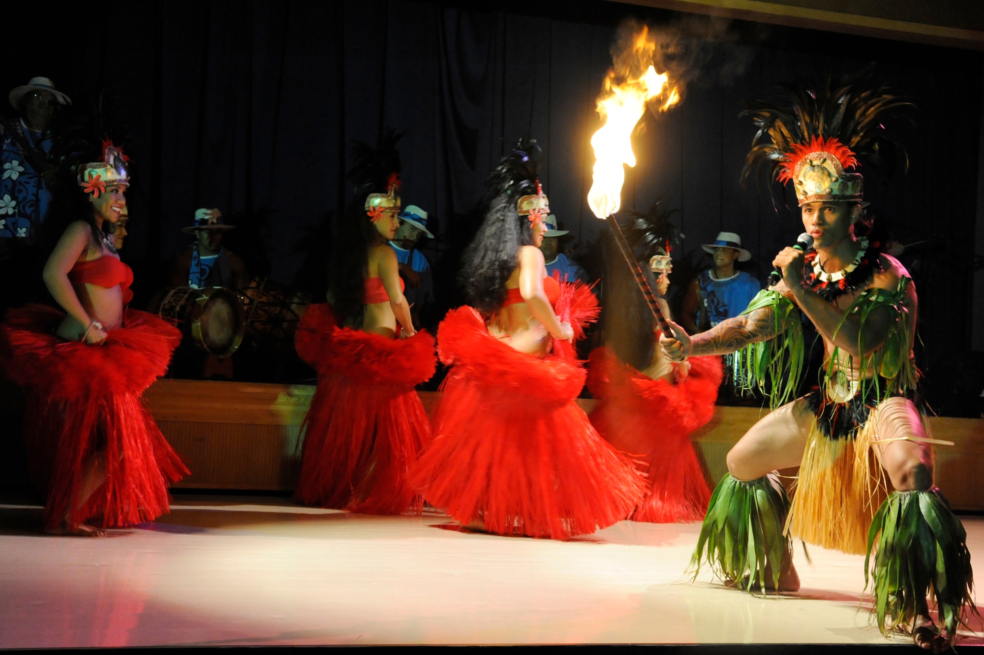 MISAWA AIR BASE, Japan -- Ma'ohi Nui, a Polynesian entertainment group, performs during a luau at the Misawa Collocated Club July 29. More than 400 members of the Misawa community enjoyed entertainment featuring Polynesian music and dance. (U.S. Air Force photo/Staff Sgt. Marie Brown/Released)