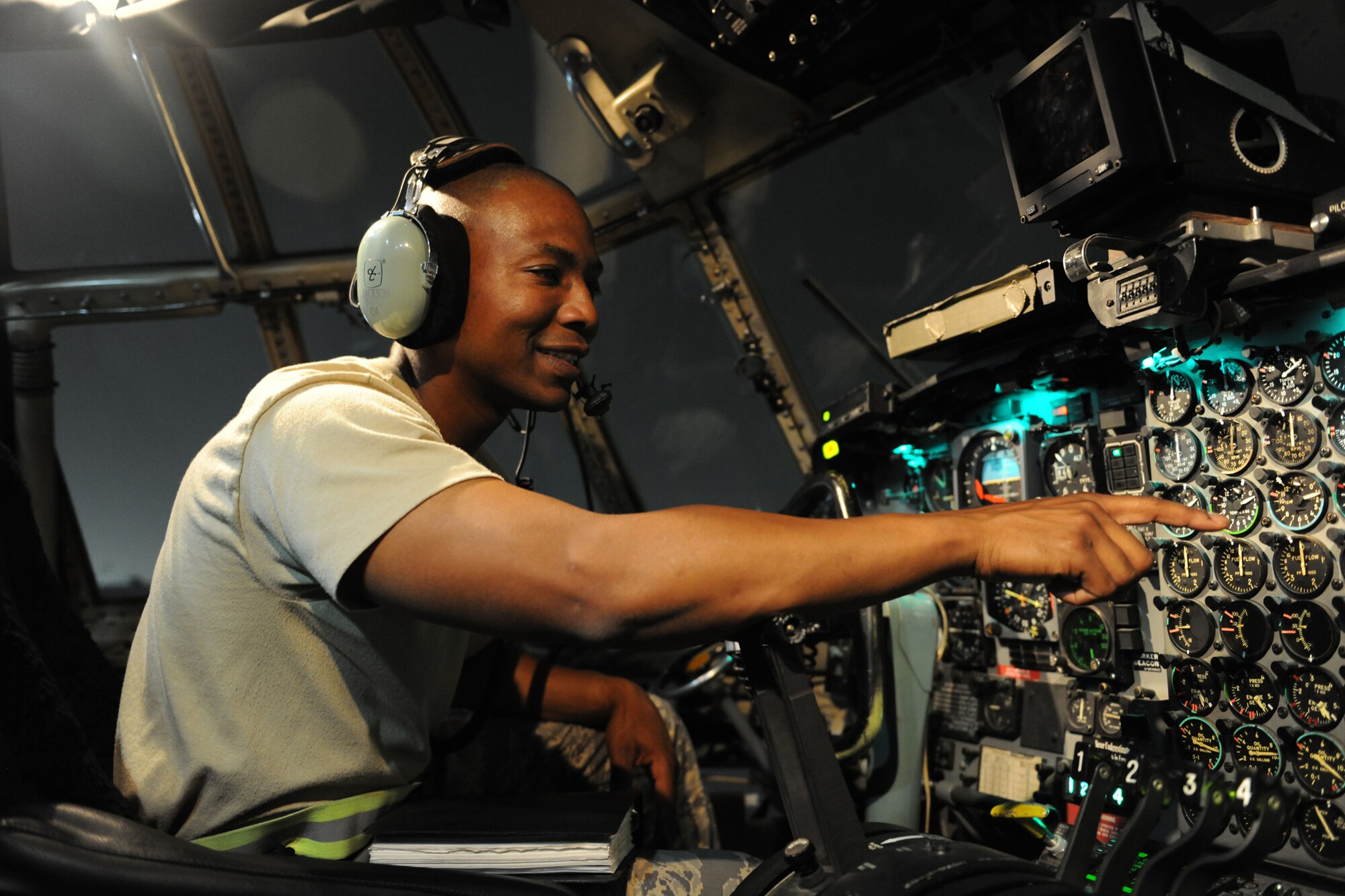 Tech. Sgt. Julnudda Jackson, 455th Expeditionary Aircraft Maintenance Squadron communication and navigation craftsman, performs a preflight inspection on the communications systems of a C-130 Hercules July 13, 2011, on the flightline at Bagram Airfield, Afghanistan. Jackson is deployed from the Alaska Air National Guard's 176th Wing at Joint Base Elemendorf-Richardson. He's a resident of Anchorage, Alaska, where he is a police officer as well as a college professor of criminal justice. (U.S. Air Force photo by Senior Airman Patrick McKenna)
