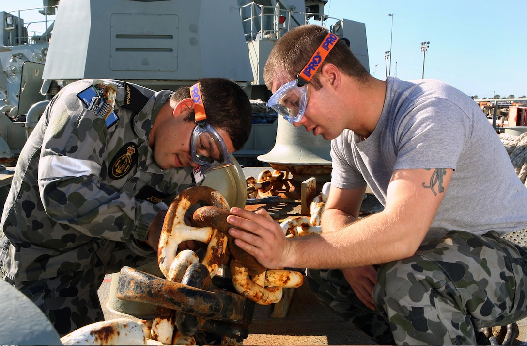 Australian Defense Force Seaman Boatswain Mates Mathew Johnson, left