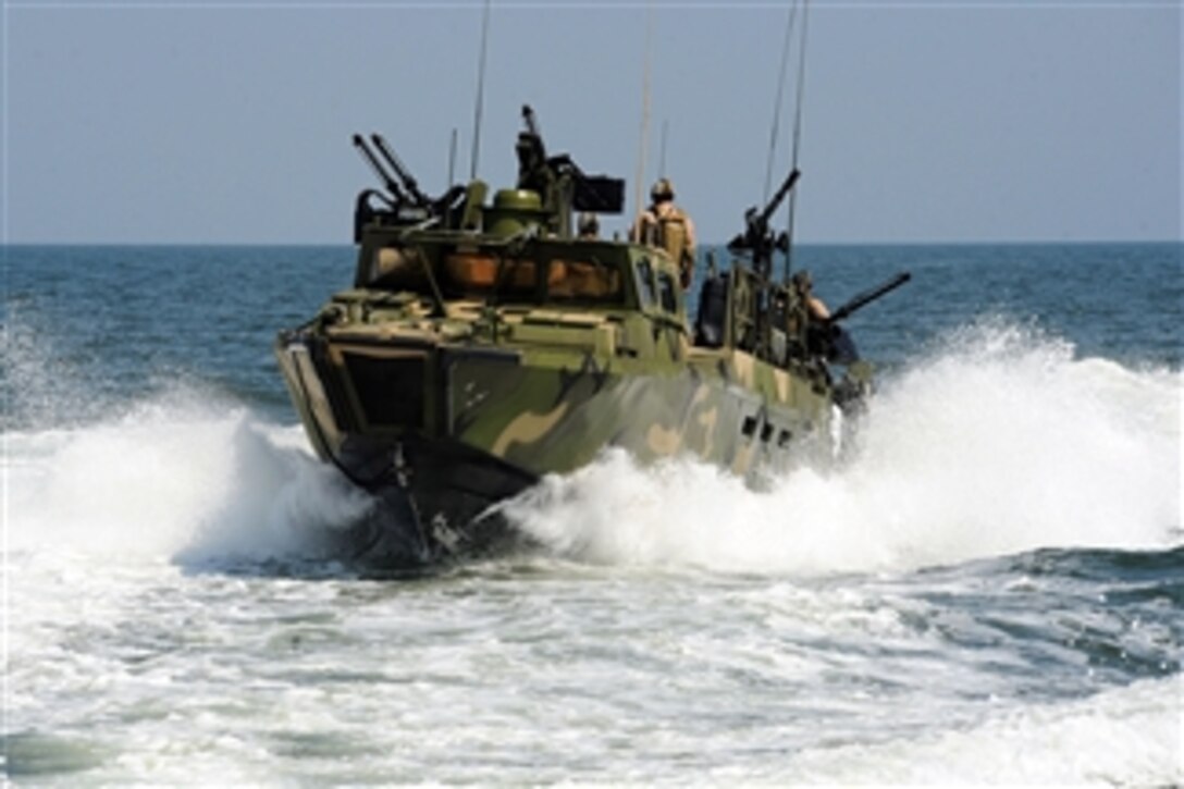 Sailors assigned to Riverine Squadron 2 participate in pre-deployment exercises in a riverine command boat near Norfolk, Va., on July 12, 2011.  Riverine Squadron 2 is stationed at Joint Expeditionary Base Little Creek-Fort Story, Va.  