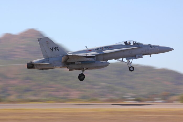 A Marine Fighter Attack Squadron 314 F/A-18 Hornet takes off from the flightline here during the first part of the surge mission in support of Exercise Southern Frontier 2011 Aug. 2. The scenario tested the Black Knights’ ability to continually provide an aerial assault to a specified area on request. They successfully launched 30 sorties in less than 14 hours.