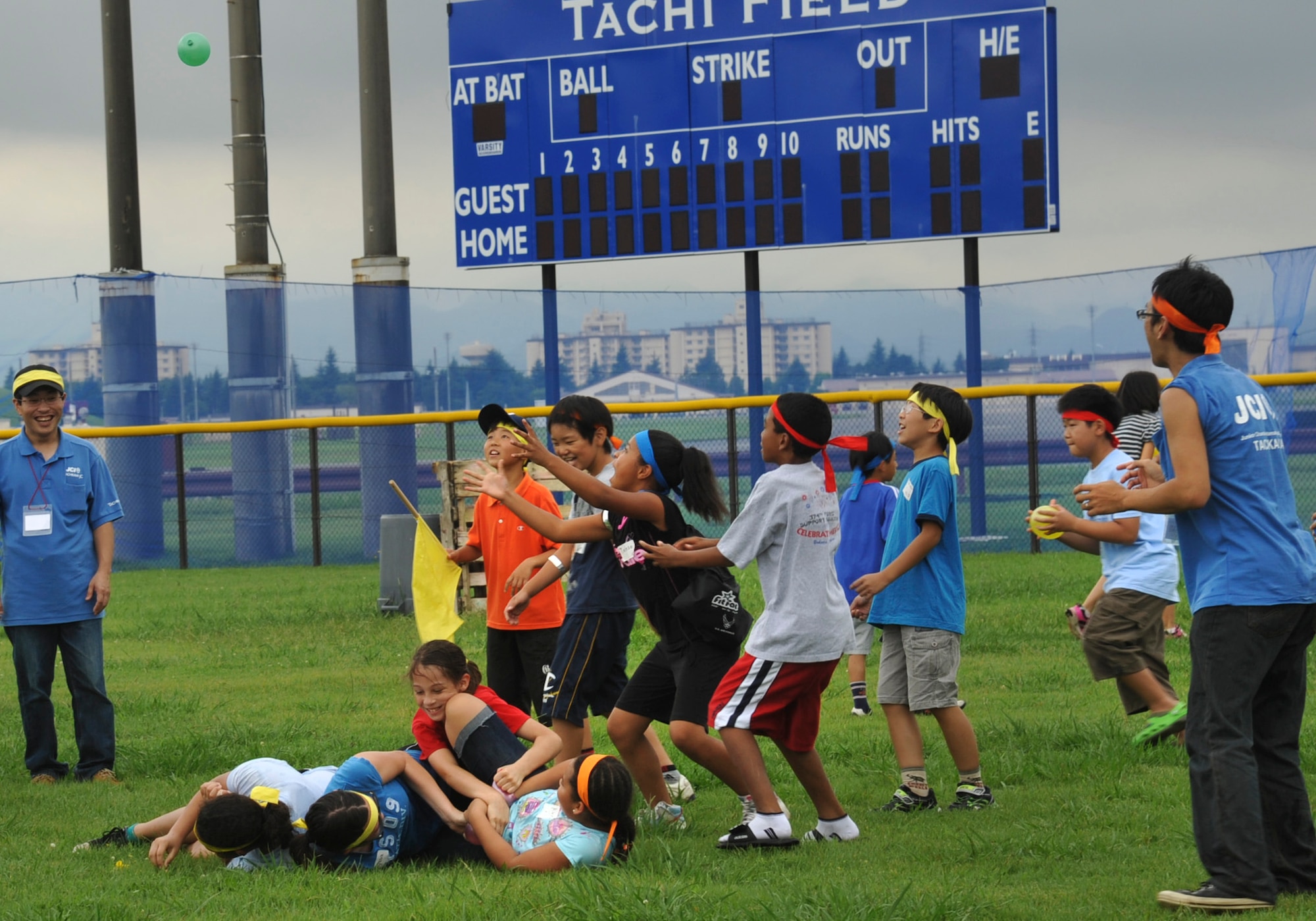 YOKOTA AIR BASE, Japan -- Japanese and American children participate in a water balloon fight during a cultural friendship barbeque at Yokota Air Base, Japan, July 30, 2011. Approximately 50 children participated in the event, which included tug-of-war games and a barbeque. (U.S. Air Force photo/Senior Airman Andrea Salazar)